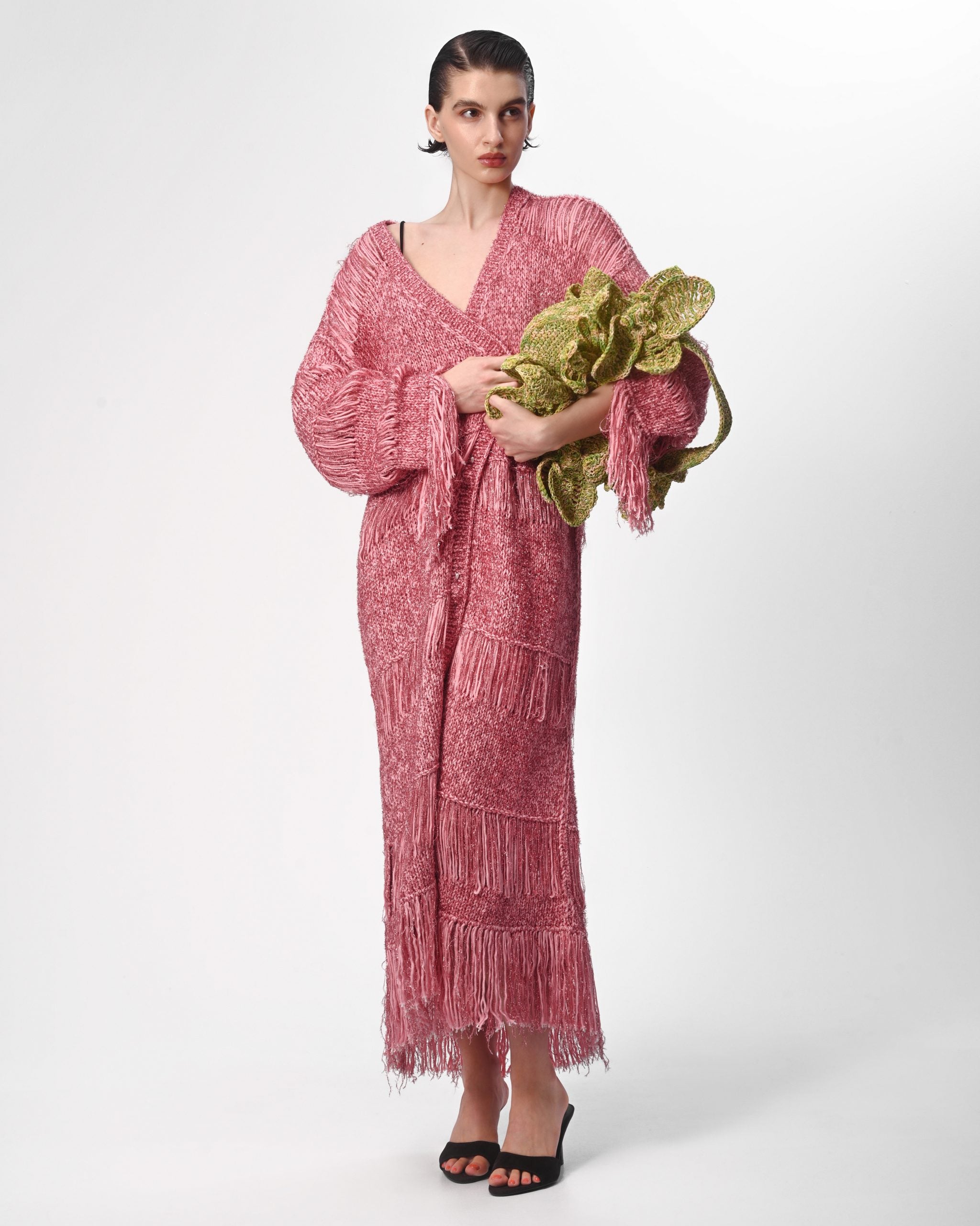 Coat worn open with fringe movement