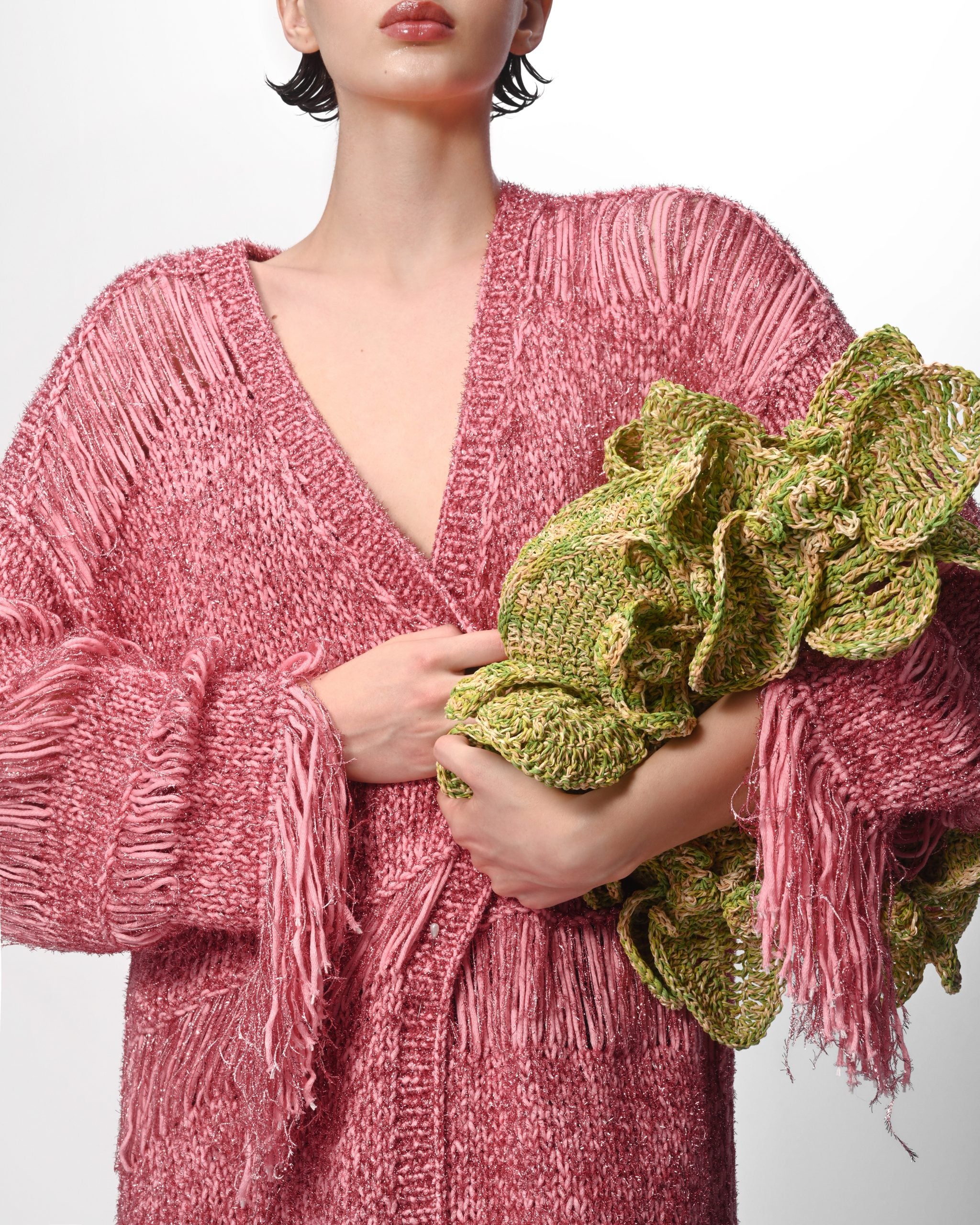 Close-up detail of knit texture and fringe