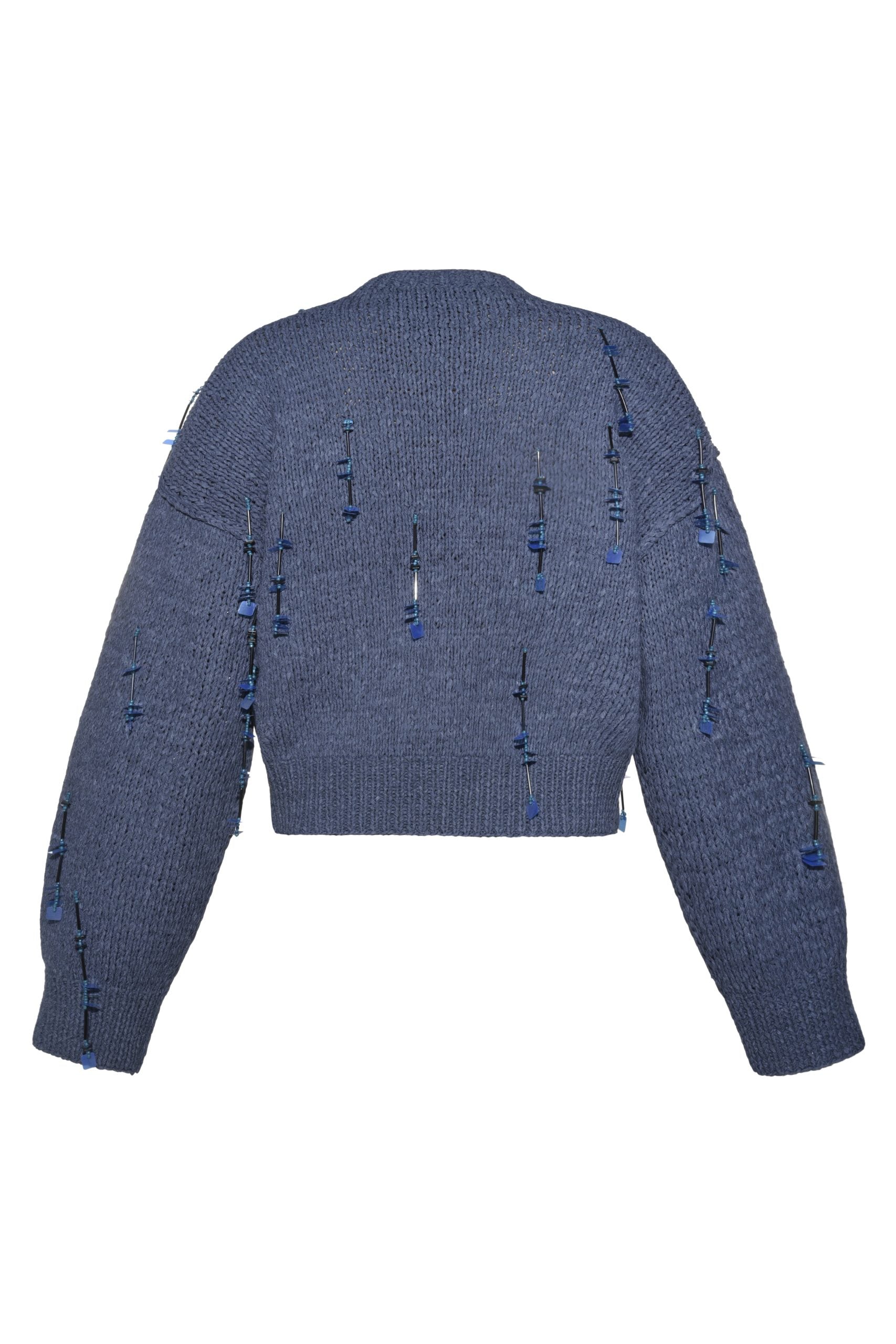 Back view of knit cardigan showing hand-applied embellishment