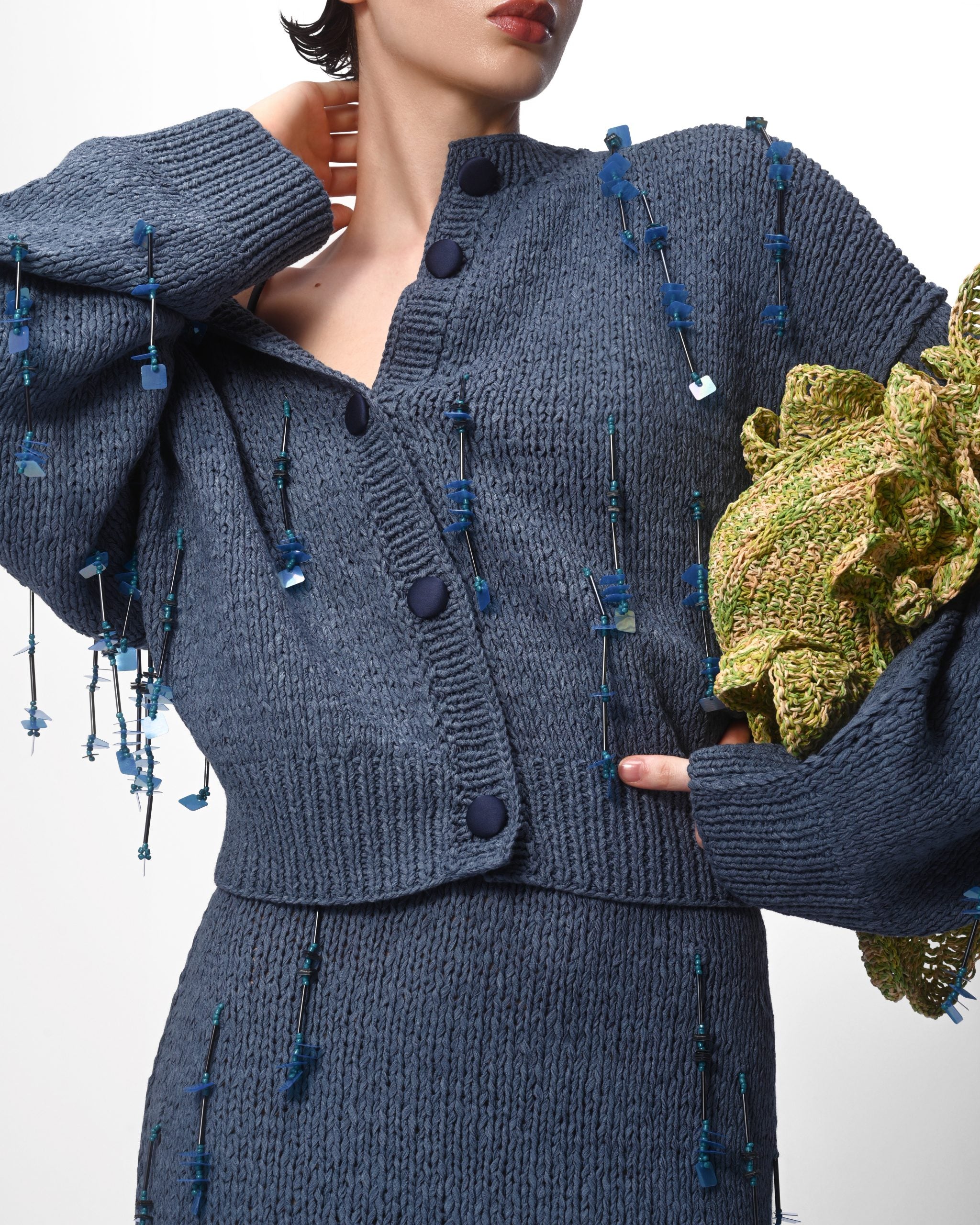 Close-up detail of embellishment on knit fabric