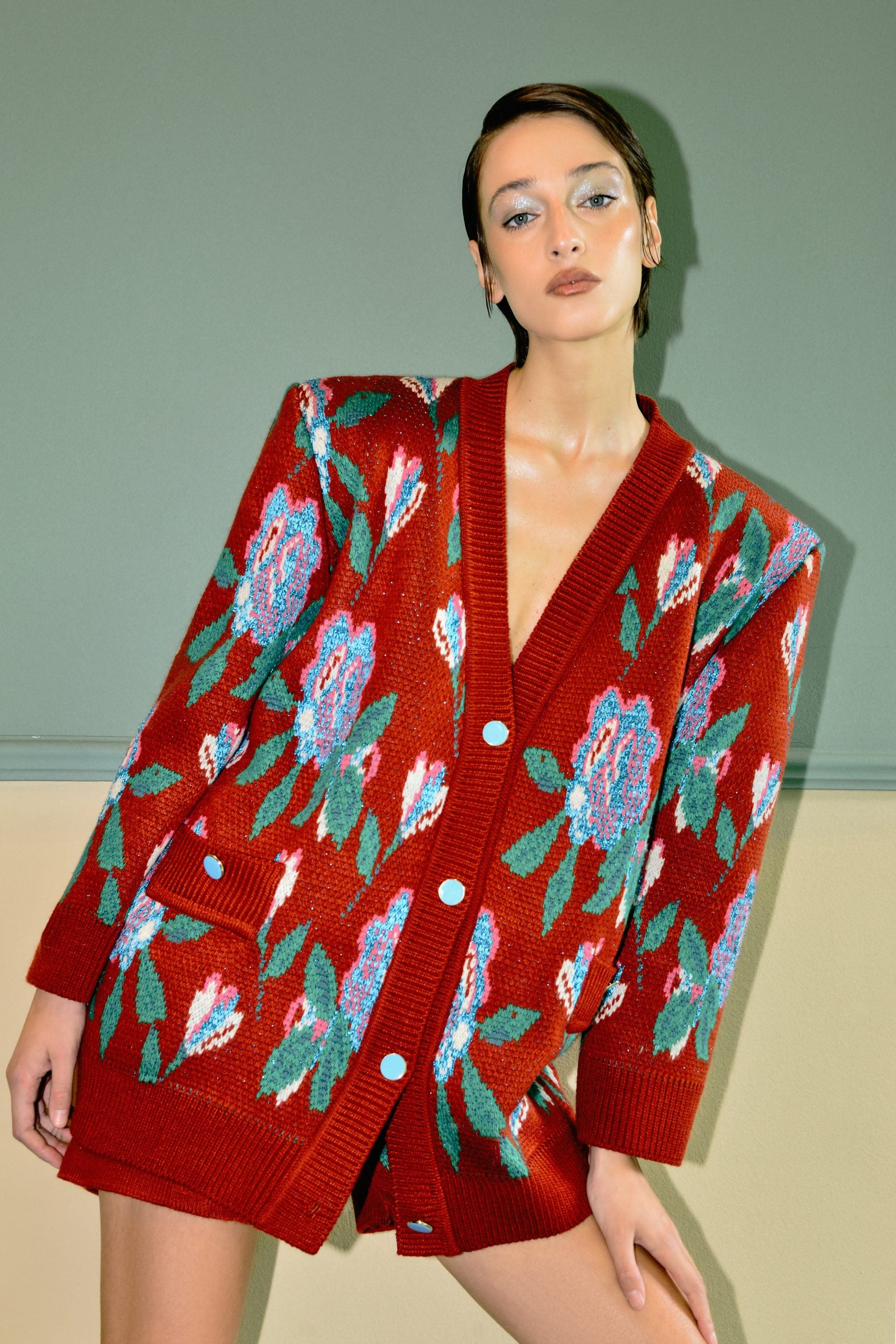 Model wearing the Lalo Red Sequence Cardigan with floral jacquard knit and button-front design