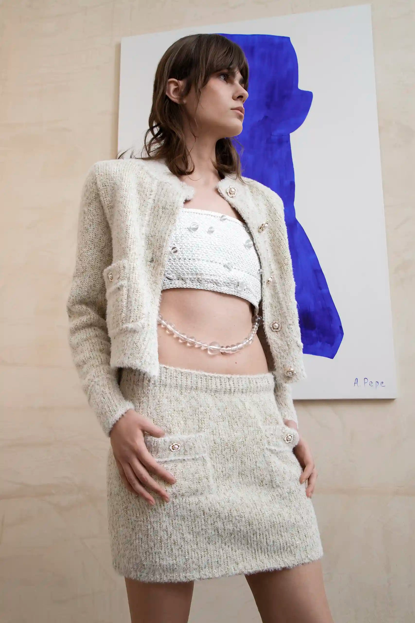 Close-up of textured knit and button detail on Sianna Cardi