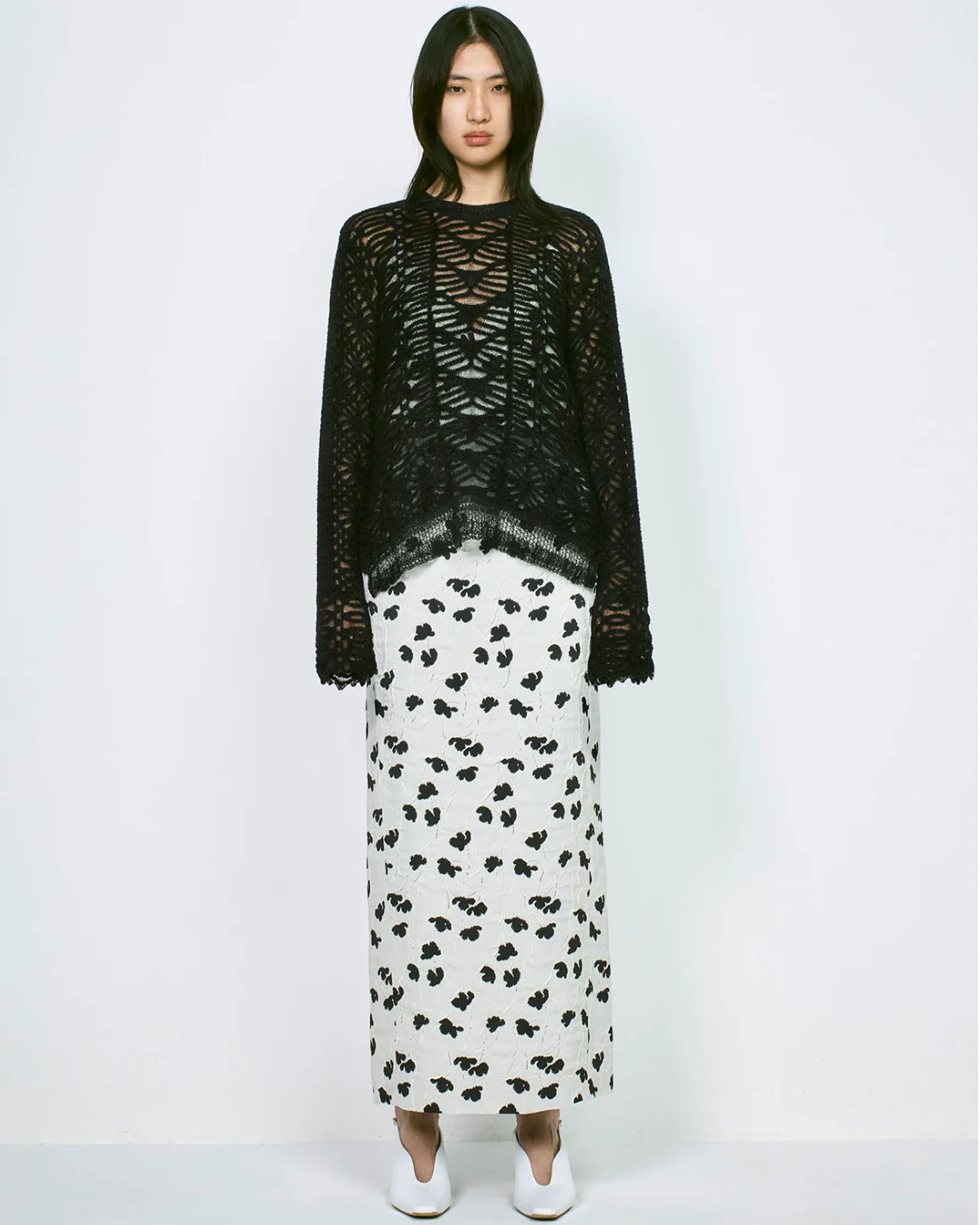 Mame Kurogouchi Double Layered Floral Jacquard Camisole in Ecru — styled on model with black knit layer