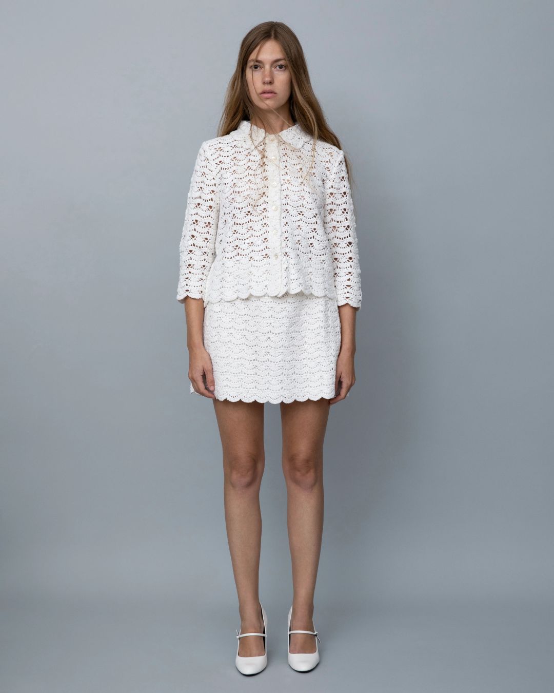 Marlies Grace Rosamund Mini Skirt in ivory white hand crochet — worn with matching jacket on model, full length view