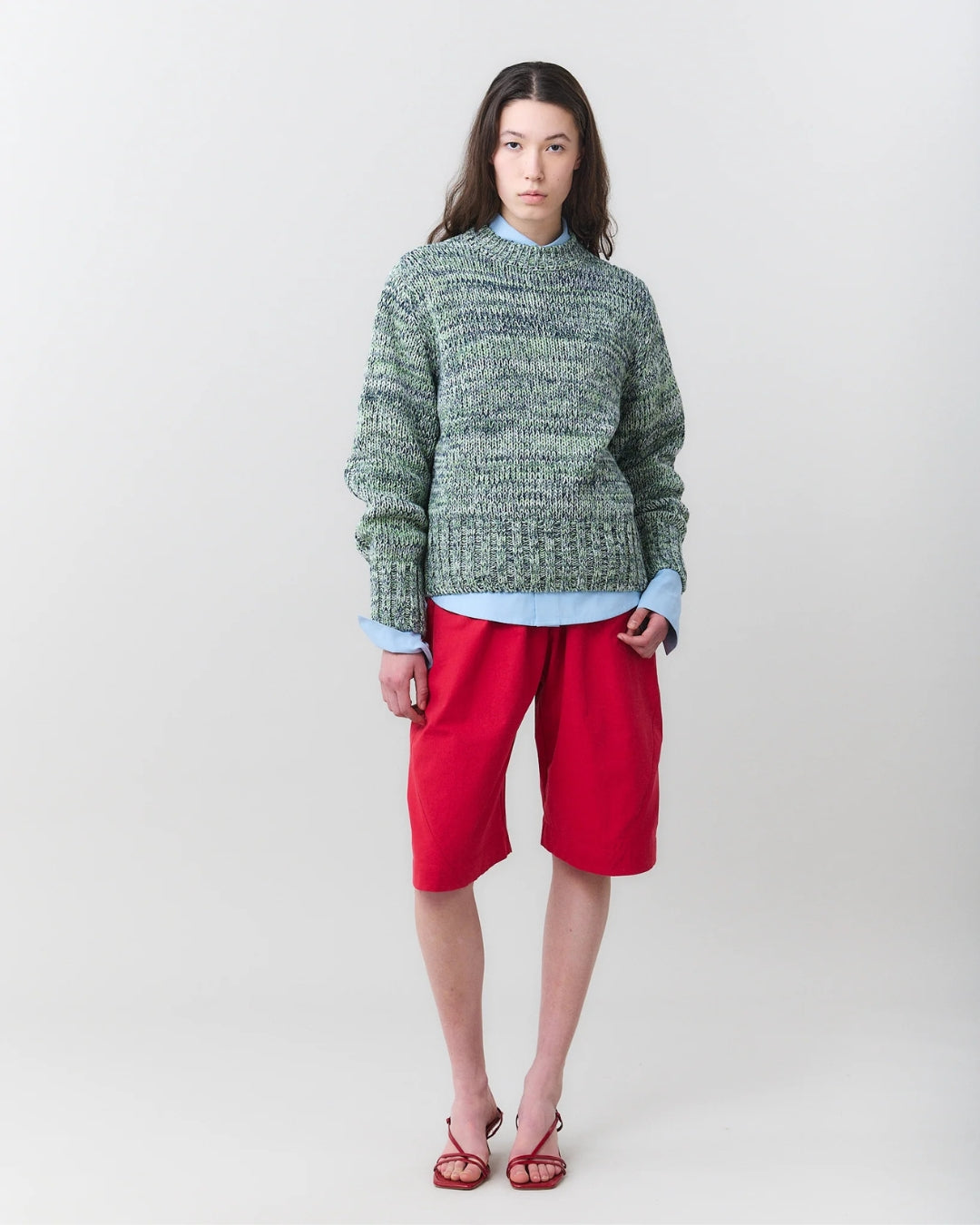 MARTAN Floyd Sweater in ice/sage/anthracite blue mélange knit, front view on model styled with red shorts

