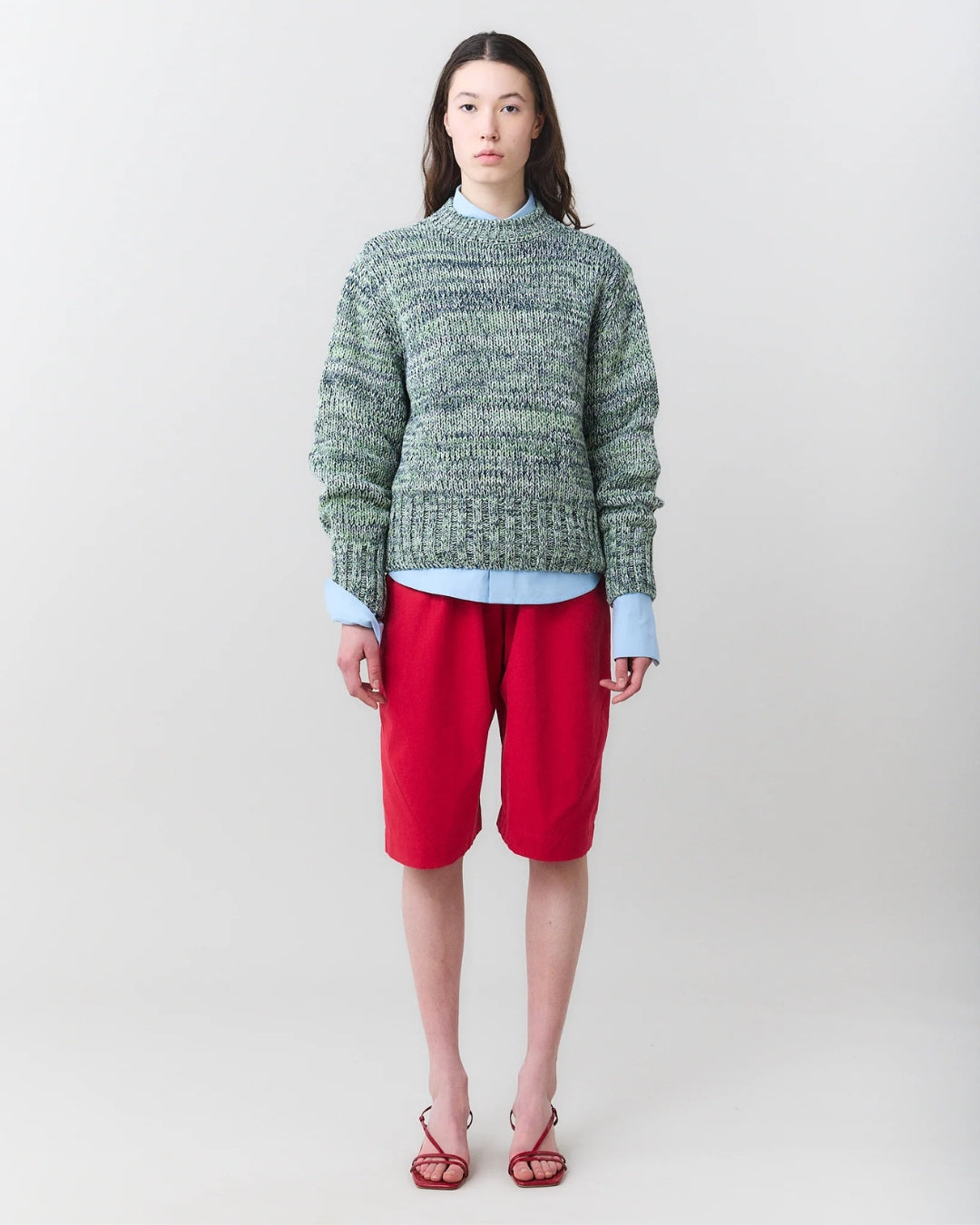 Close-up three-quarter view of MARTAN Floyd Sweater showing half-high neckline and mélange yarn detail