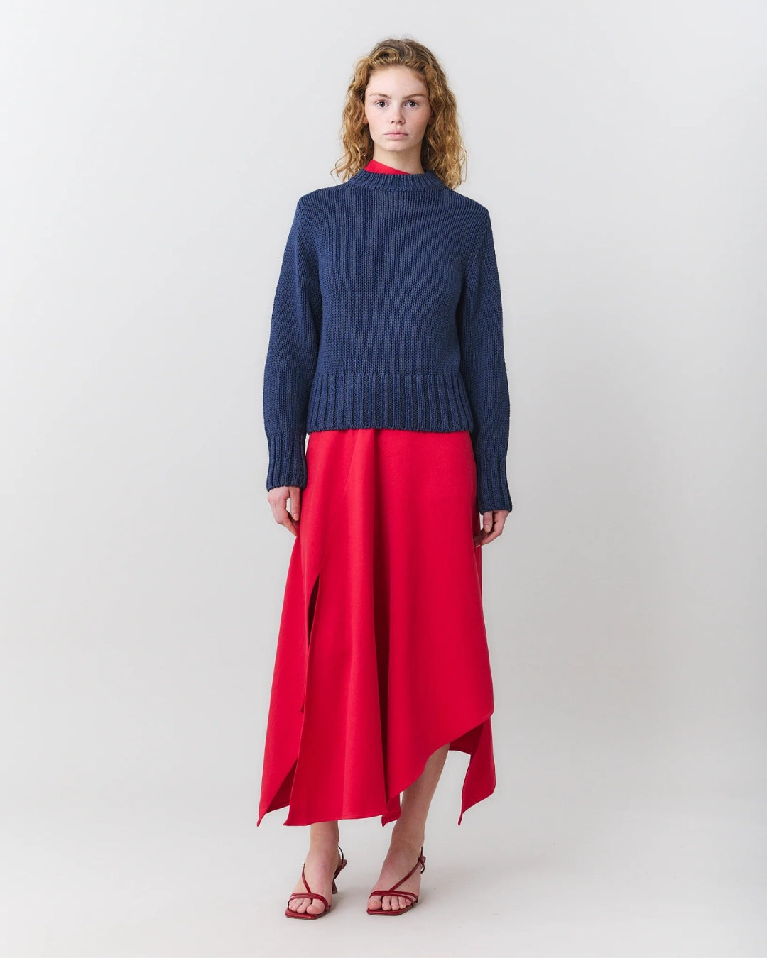 MARTAN Floyd Sweater anthracite blue, full length front view showing overall silhouette styled with red skirt