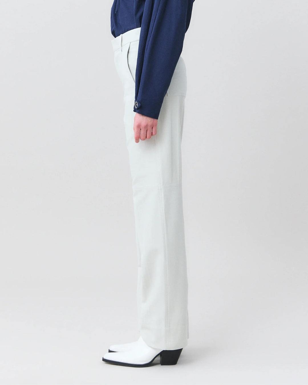 Close-up side view of MARTAN Jelle Trousers showing straight fit and panel seam detail
