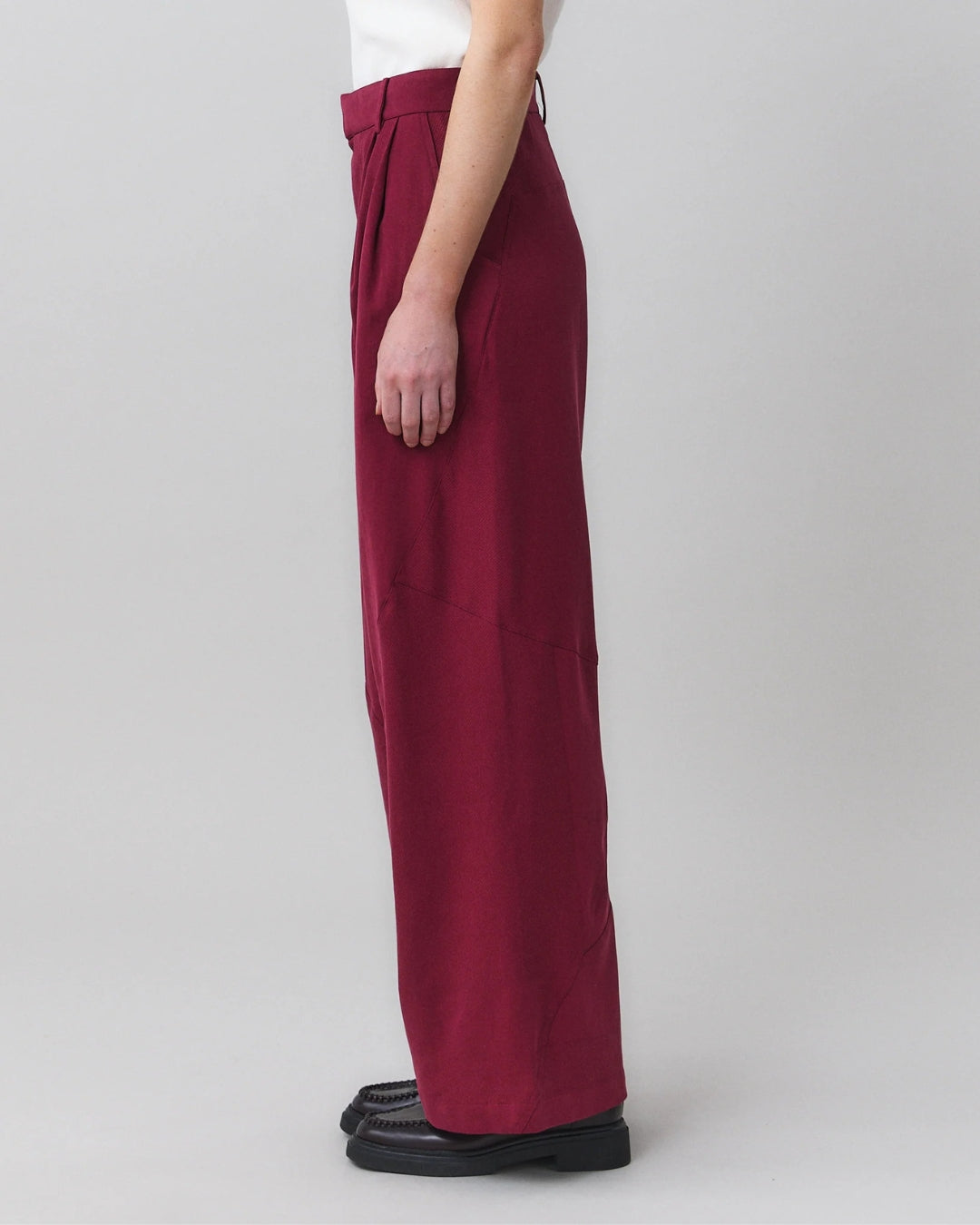 Close-up side view of MARTAN Jo Trousers showing double pleat and wide leg silhouette