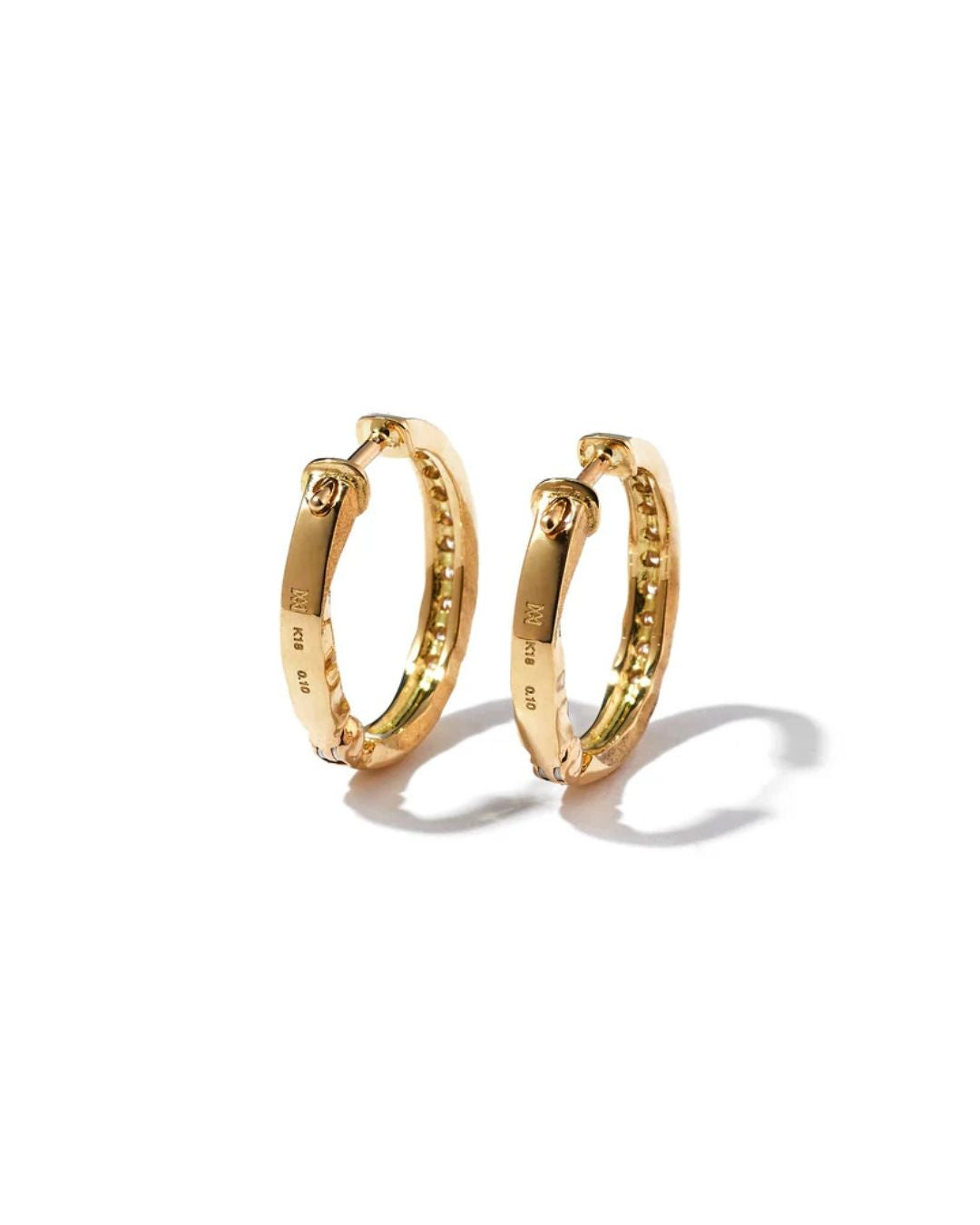 Reverse view of the Milamore En Pavé Hoops showing their hinged fastening and gold hallmarks.