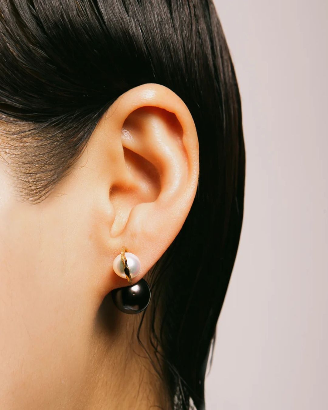 Model wearing the Milamore Kintsugi Duo Pearl Earring with a Black South Sea pearl.