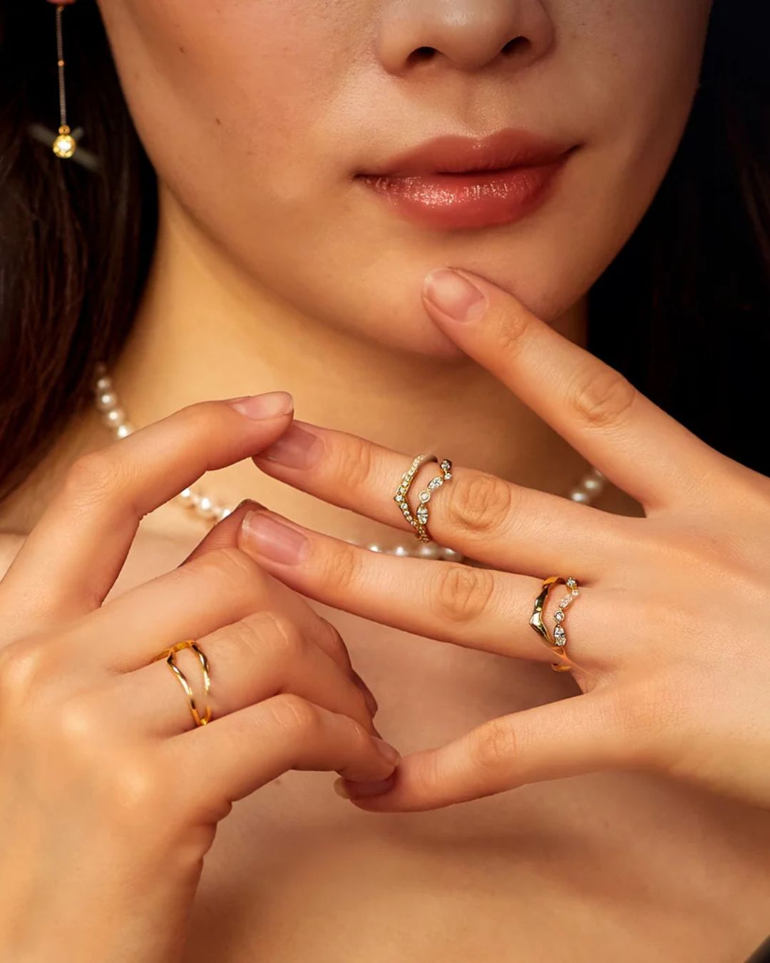 Model wearing Milamore Kintsugi diamond rings in 18K yellow gold