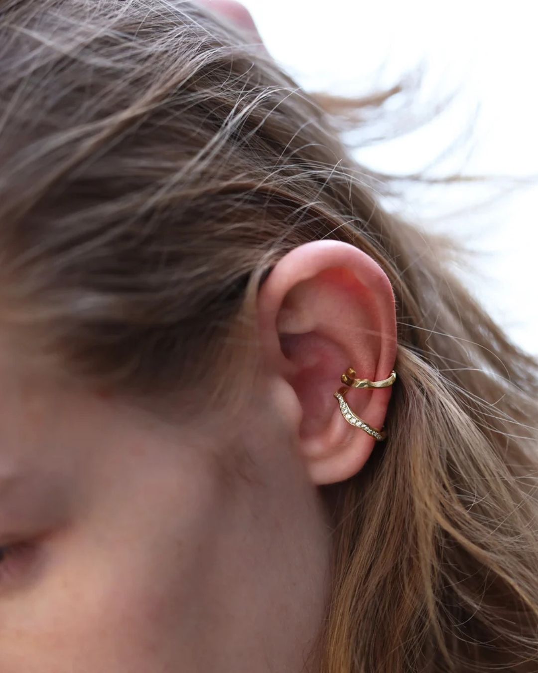 Model wearing the Milamore Kintsugi Pavé Vine Ear Cuff in solid yellow gold.