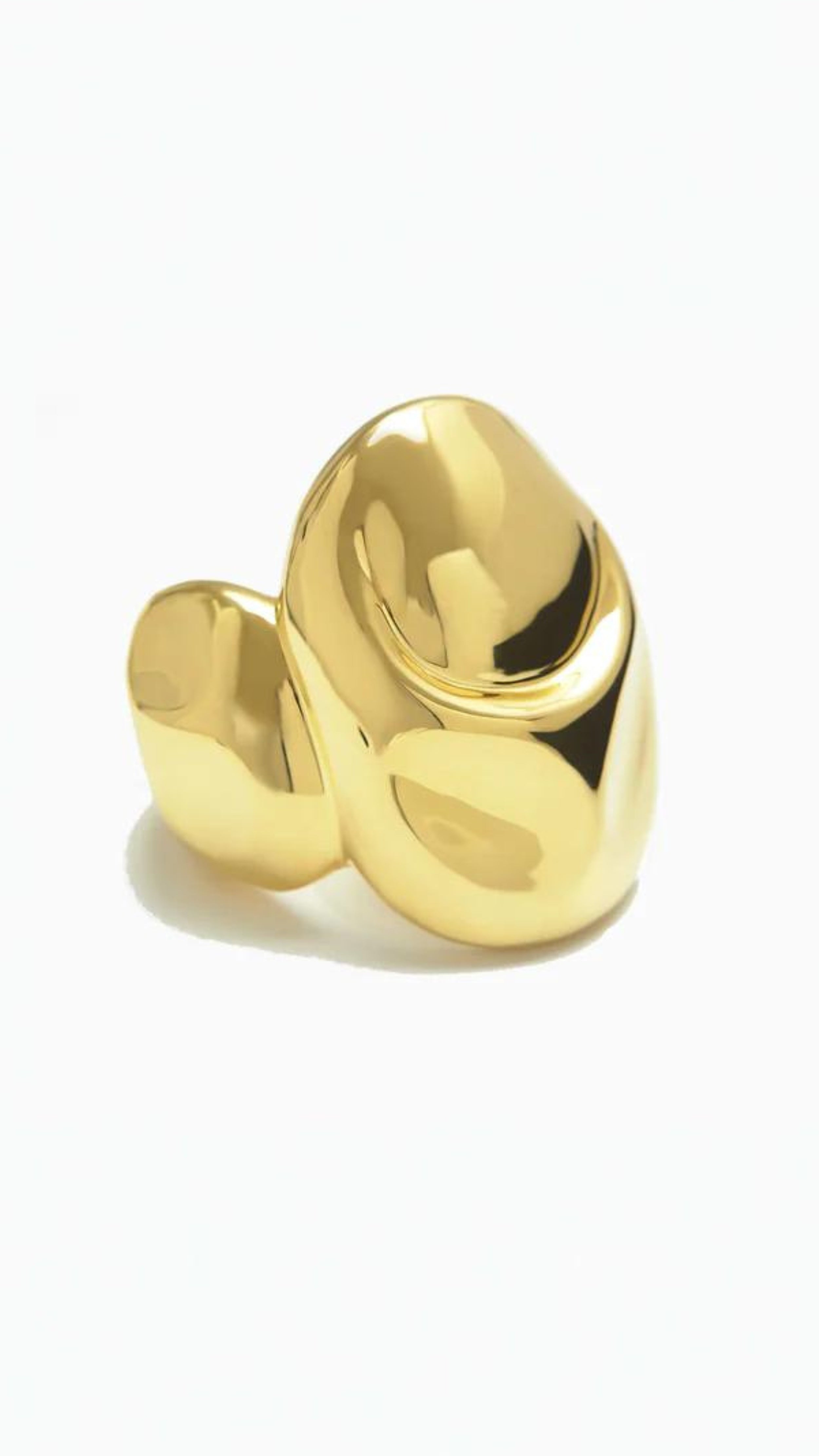 Monica Sordo Cubagua Cuff Bracelet is a statement piece crafted in beautiful organic shaped 24 carat plated gold. Photo shows cuff bracelet from the front. Sustainable and fair trade jewelry.