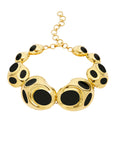 Monica Sordo, Peninsula Choker Necklace in Black Onyx. statement choker is made with organically shaped 24 carat gold plated ovoids and black onyx inlay. Adjustable length. Photo of the product shown from the front.