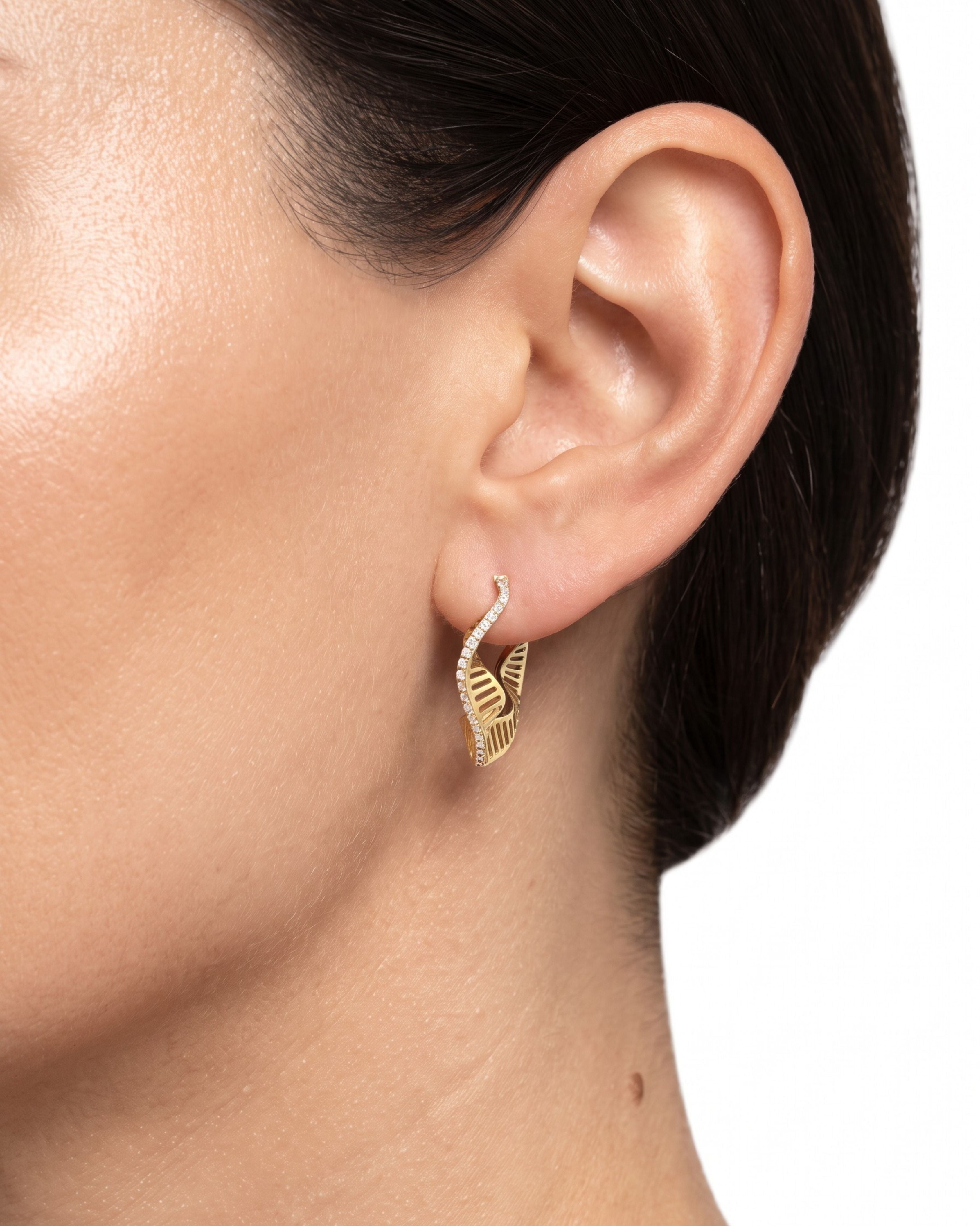 L'Atelier Nawbar Wave Hoops in 18K Yellow Gold — worn on ear for scale