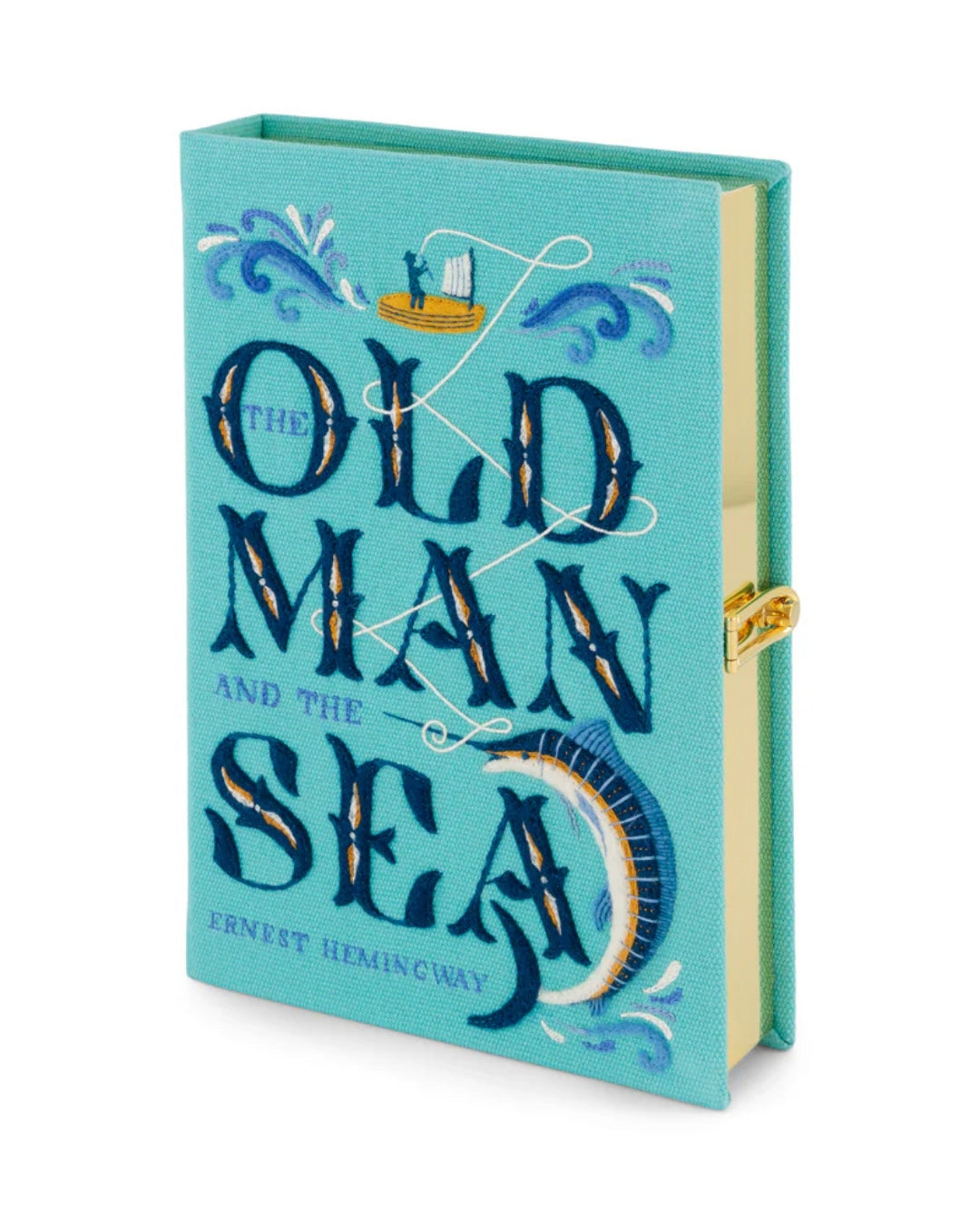Angled three-quarter view of the Olympia Le-Tan Old Man and the Sea clutch on white, showing the full embroidered teal front cover with typographic title design and gold-tone frame at the side.