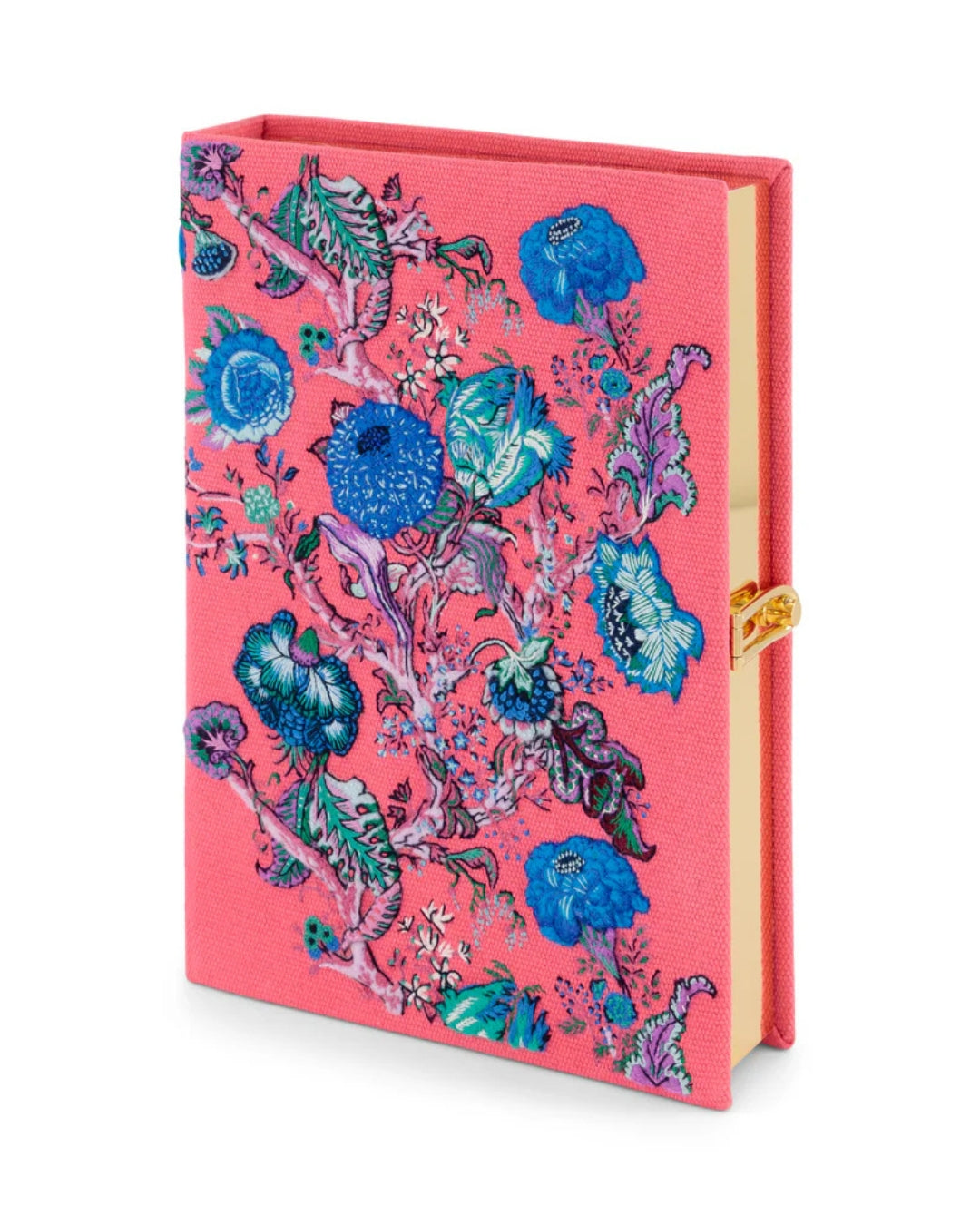 Three-quarter lifestyle view of the Jannah Book Clutch standing upright against a blue and white botanical wallpaper, showing the full embroidered front and embroidered "Jannah" spine.
