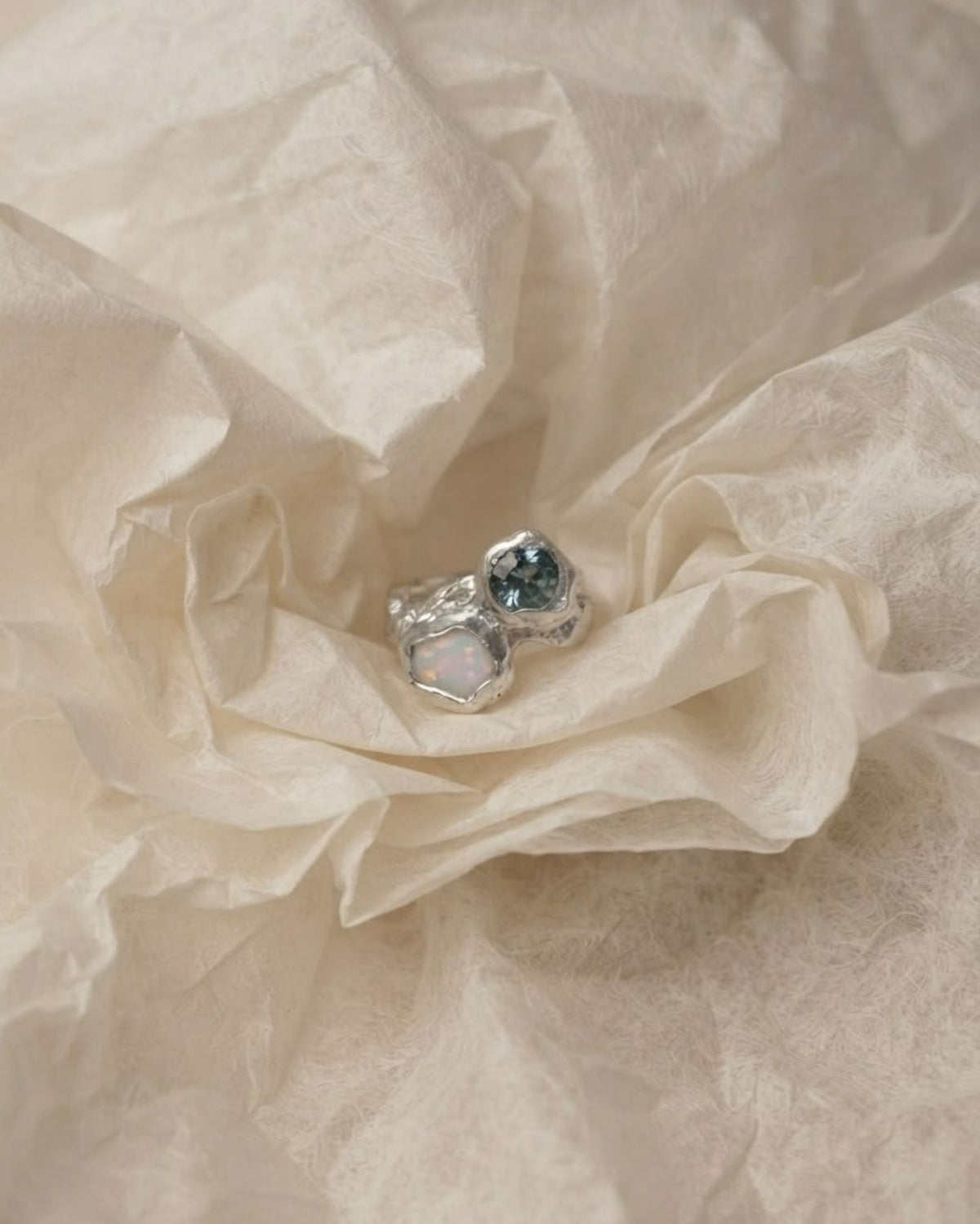 Camila D. Daneri Opal &amp; Moissanite Ring in sterling silver, close-up nestled in tissue paper