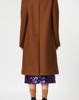 Plan C Chestnut Wool Overcoat. Classic but with a modern esthetic with coat jacket. Chestnut brown Italian wool with double layers. Midi length and long sleeves. Shown on model facing back.