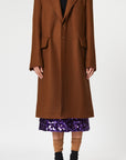 Plan C Chestnut Wool Overcoat. Classic but with a modern esthetic with coat jacket. Chestnut brown Italian wool with double layers. Midi length and long sleeves. Shown on model facing front.
