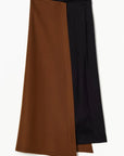 Plac C Contrast Midi Skirt. Paneled midi skirt in sofy brown chestnut wool and black satin. Modern and classic in shape and colors. Shown here from the front view.