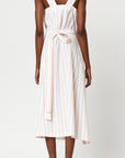Plan C Cotton Dress in Bellini Stripe Italian-made soft cotton midi dress with bellini stripes. With a square neckline, front draping and cinched waist with fabric belt. Shown on model facing back.