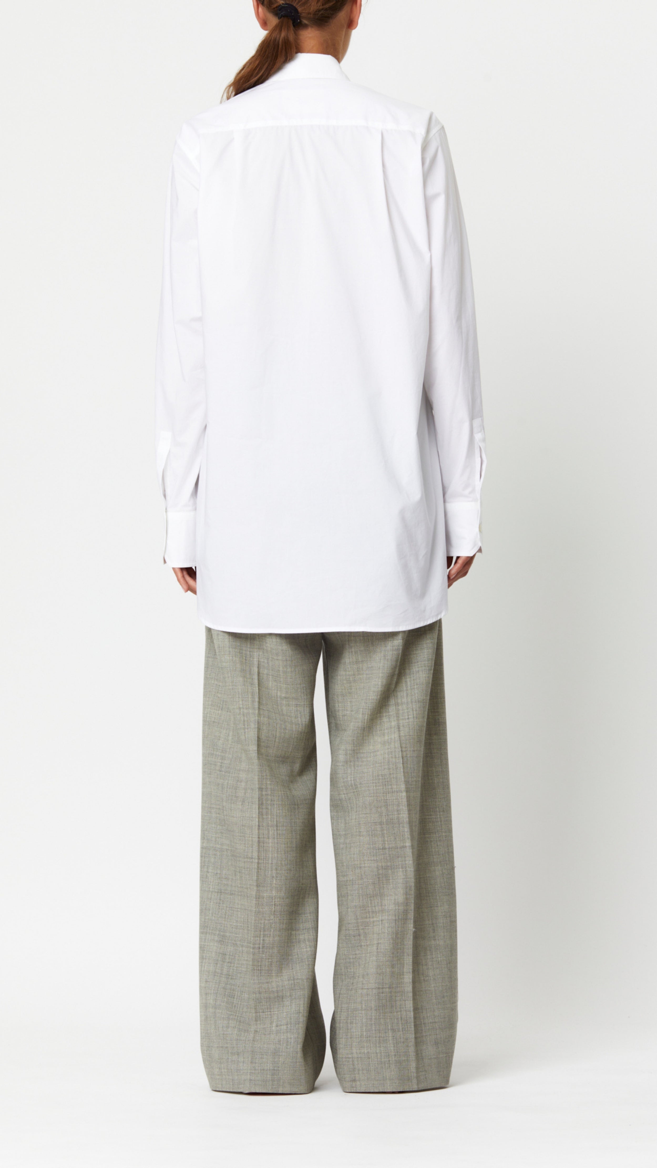 Plan C Cotton Poplin Tuxedo Shirt 100% cotton tuxedo style blouse with a pleated shoulder, long sleeves, and cuffs. Slightly oversize men&#39;s style fit. Shown on model facing back.
