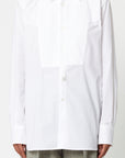 Plan C Cotton Poplin Tuxedo Shirt 100% cotton tuxedo style blouse with a pleated shoulder, long sleeves, and cuffs. Slightly oversize men's style fit. Shown on model facing front.