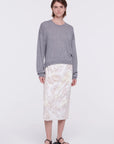 Plan C Panama Sequined Midi Skirt, Cotton panama midi skirt crafted in Italy with front panel of white sequins. This skirt has a contrasting black elastic waistband. The skirt falls to knee length.  Shown on model facing front.