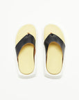 Plan C Platform Thong Sandal. Made in Italy the thong leather detail is in black with the sole interior in a pale yellow. With a slight platform, the outer edges are in white. Photo shown from above.