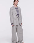 Plan C Pleated Melange Wide Leg Pants. tailored-cut and high-rise fit and wide leg trouser. With double pleating, button fastening closure, and pockets. Made in Italy from a light weight grey melange wool panama weave. Shown on model.