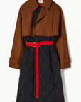 Plan C Quilted Double Breasted Coat. Black quilted culpro and cotton interior with a chestnut brown wool over piece at the collar, sleeves and waist. Highlighted by a wrap around long belt at the waist. Show from the front view.