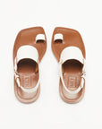 Plan C White Toe Ring Sandals. Made in Italy, these sandals have a strap across the foot, buckle around the heel and a ring of leather at the big toe. Flat sandals with a leather sole. Photo shown from the top.