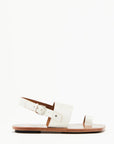 Plan C White Toe Ring Sandals. Made in Italy, these sandals have a strap across the foot, buckle around the heel and a ring of leather at the big toe. Flat sandals with a leather sole. Photo shown from the side.