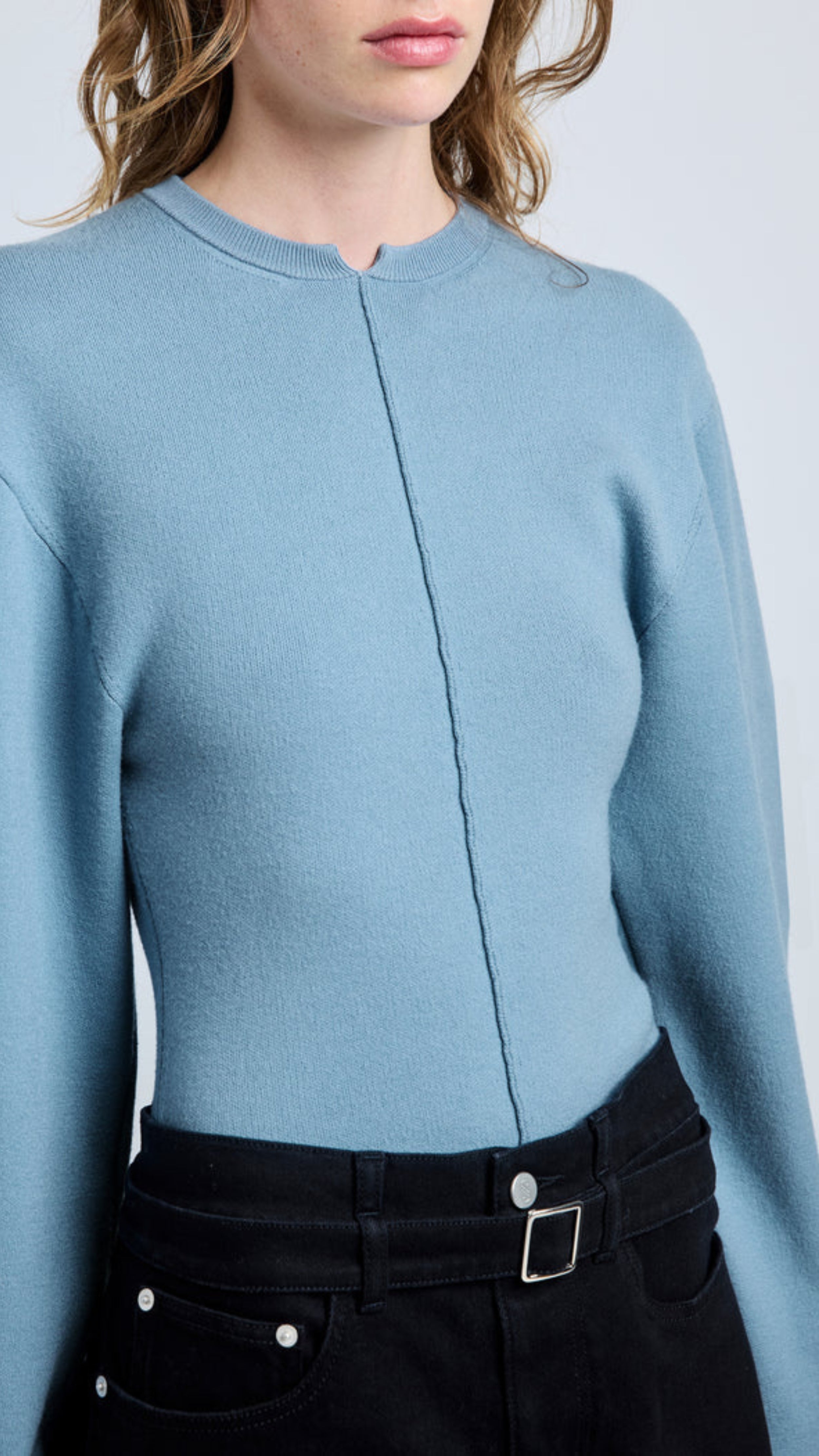 Lark blue Carolina sweater in souffle knit with classic crew neckline, slightly puffed sleeves, center hemline, and v cut collar.