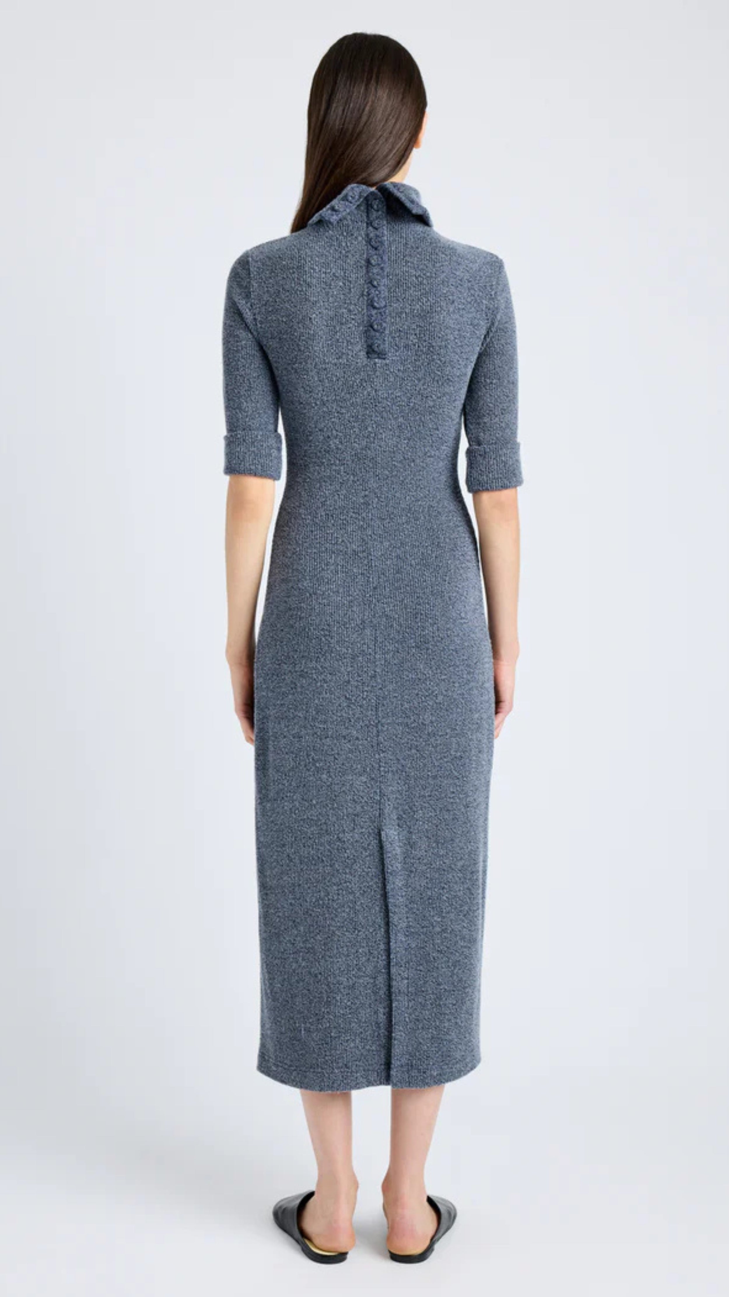 Grey blue boucle knit dress with buttoned back placket, mock turtle neckline, cap sleeves, and center back slit.