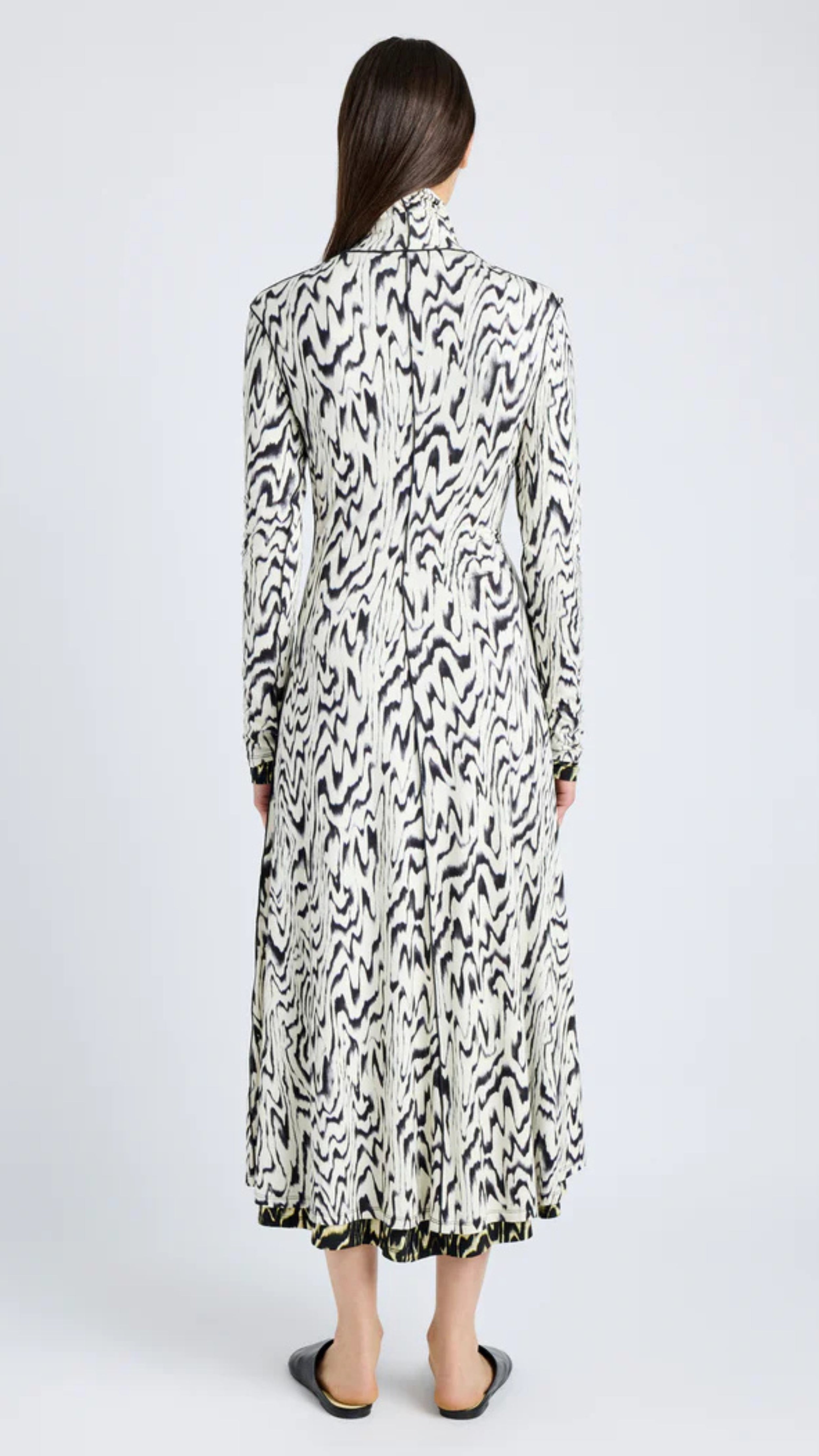 Black and white abstract printed jersey mid-length dress with folded neck and long sleeves, Proenza Schouler design.