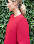 Rochas Paris Boucle Mini Dress in Red. Wool blend mini dress in a beautiful red. Lined in silk. The sleeves are cuffed and there are front pockets. This photo shows a closer view of the fabric and collar.