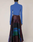 Roksanda Ameera Skirt in silk. Organic painted pattern of rich plum, blue and green colors. With a fitted band waist and hidden back zipper. This is a floor length skirt. Skirt shown on the model facing to the back