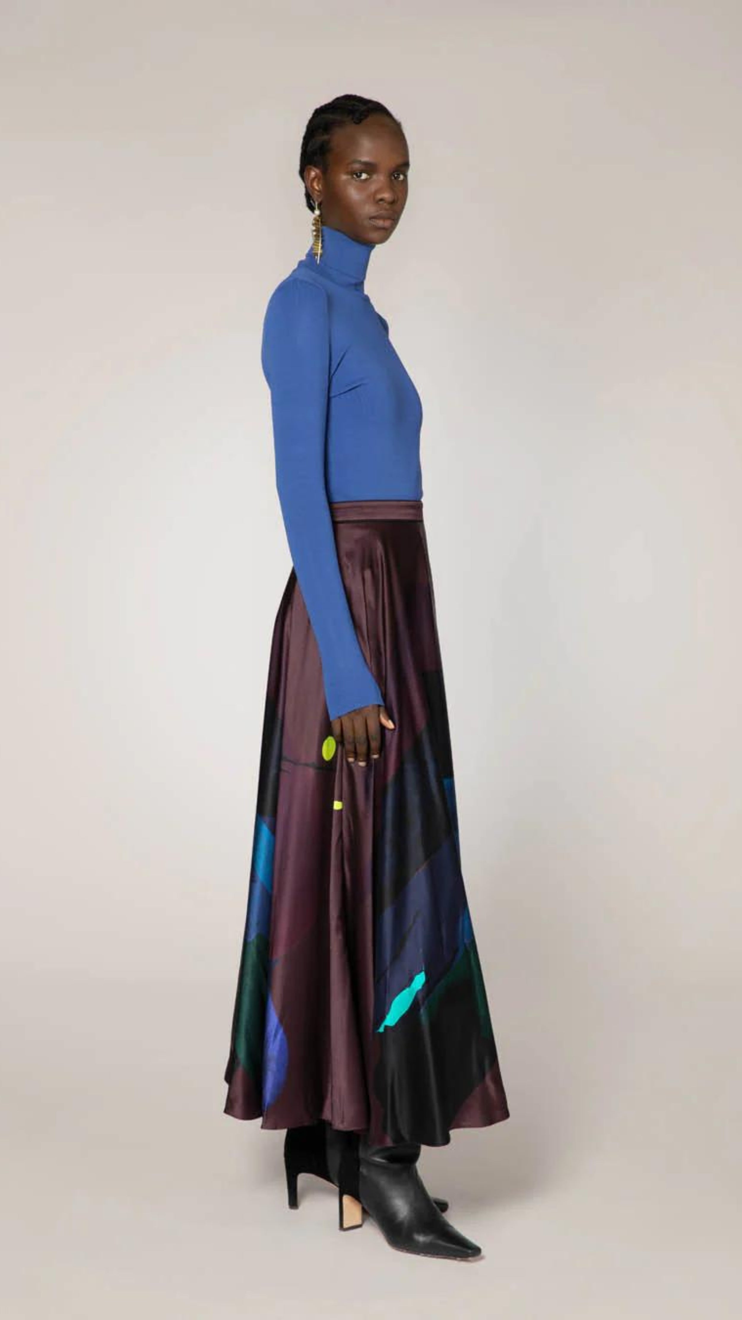 Roksanda Ameera Skirt in silk. Organic painted pattern of rich plum, blue and green colors. With a fitted band waist and hidden back zipper. This is a floor length skirt. Skirt shown on the model facing to the side