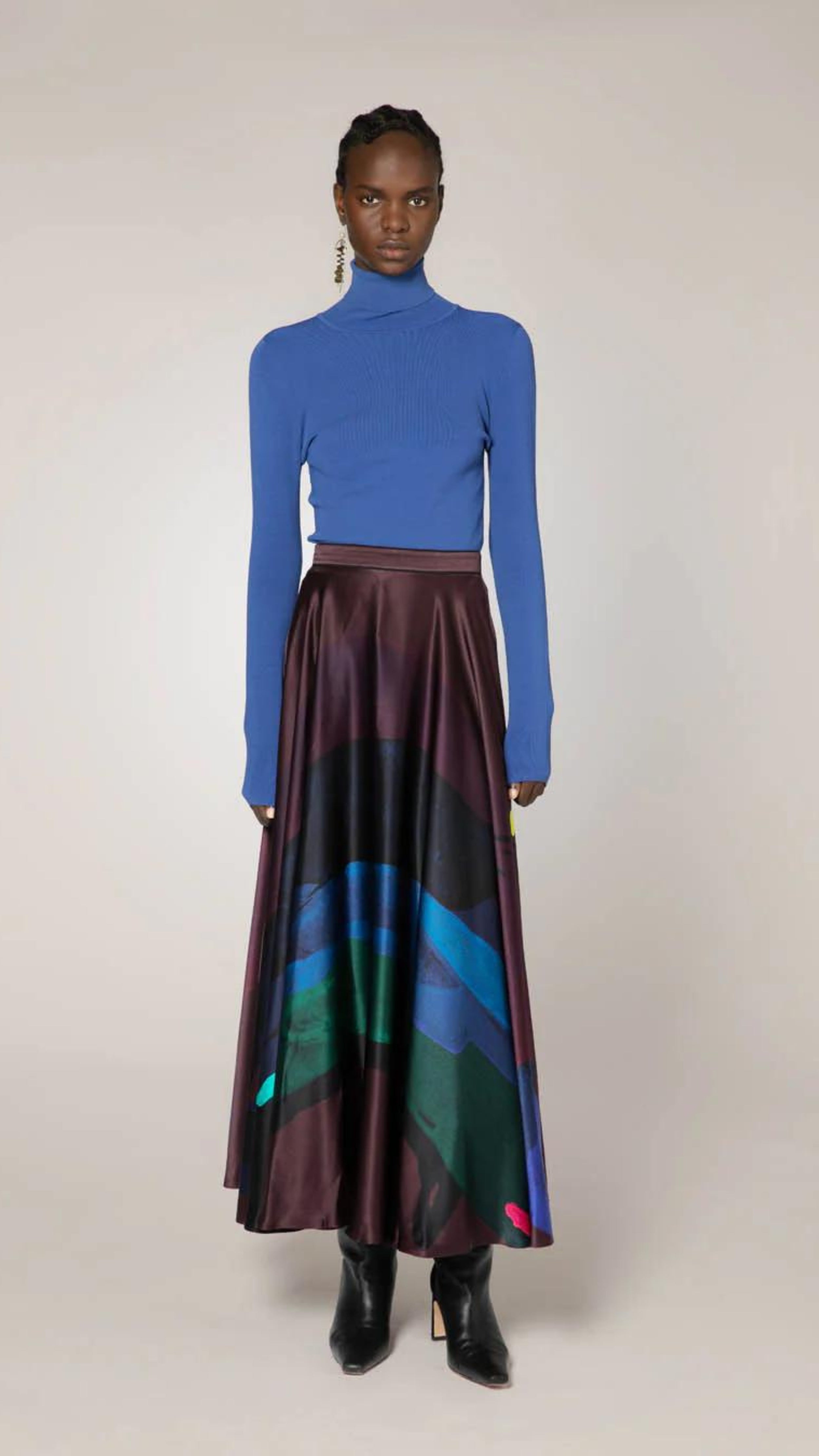 Roksanda Ameera Skirt in silk. Organic painted pattern of rich plum, blue and green colors. With a fitted band waist and hidden back zipper. This is a floor length skirt. Shown in the model facing front.