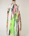 Roksanda Arletta Dress. Limited edition one of ten pieces created. Hand printed on parachute fabrics for an original pattern and designer of pinks, oranges, greens and white. Draped front with front belt and cape like back. Long maxi dress for evening gown looks. Shown on model facing back.