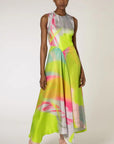 Roksanda Zenobia Dress. Fresh modern style silk twill dress in neon limes, pinks and soft blue. With an racer back style top, asymetrical dropped waist and midi length loose fitting skirt. Shown on model facing front.