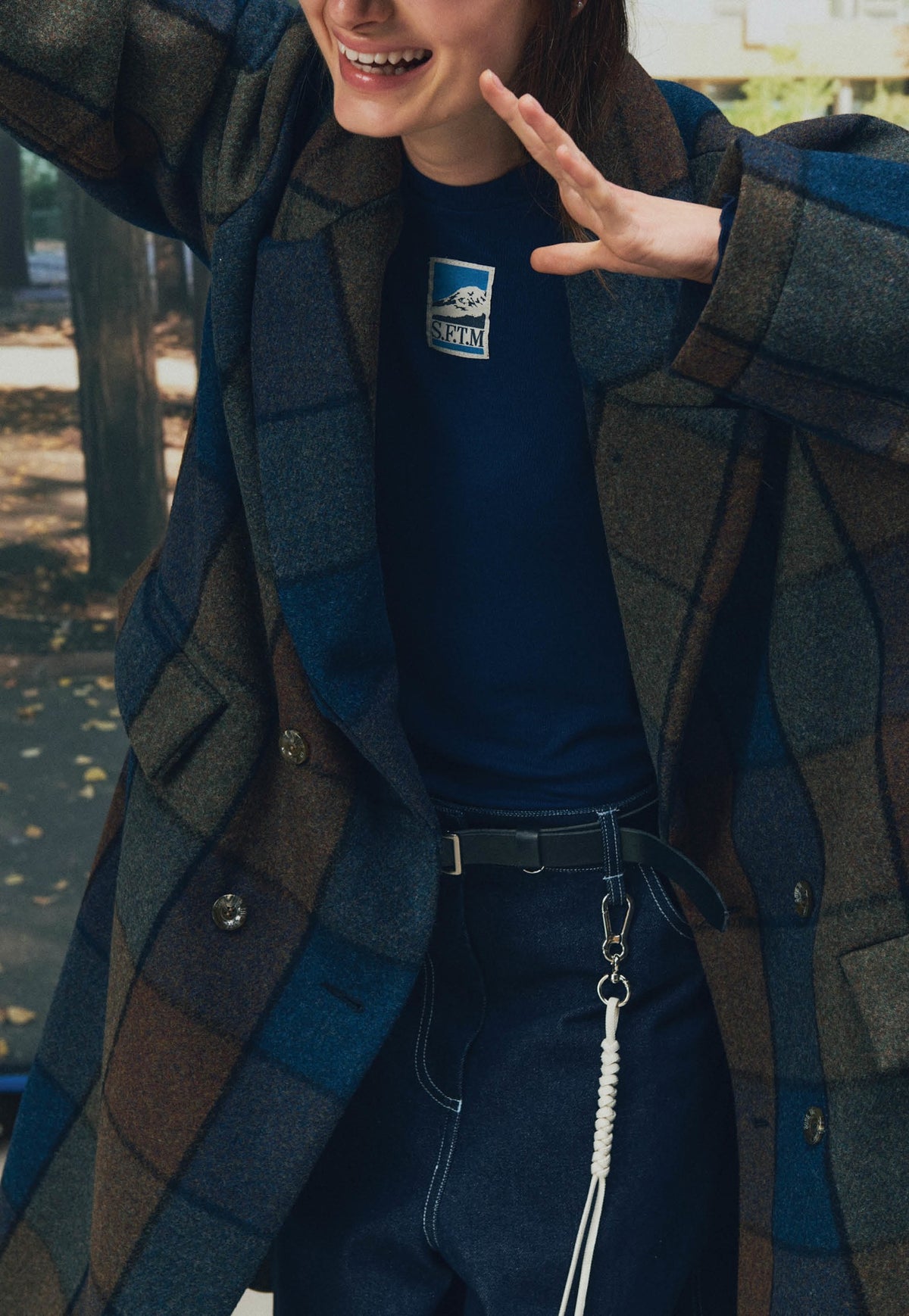 Song for the Mute Playground lookbook detail of the Bear Check double-breasted overcoat