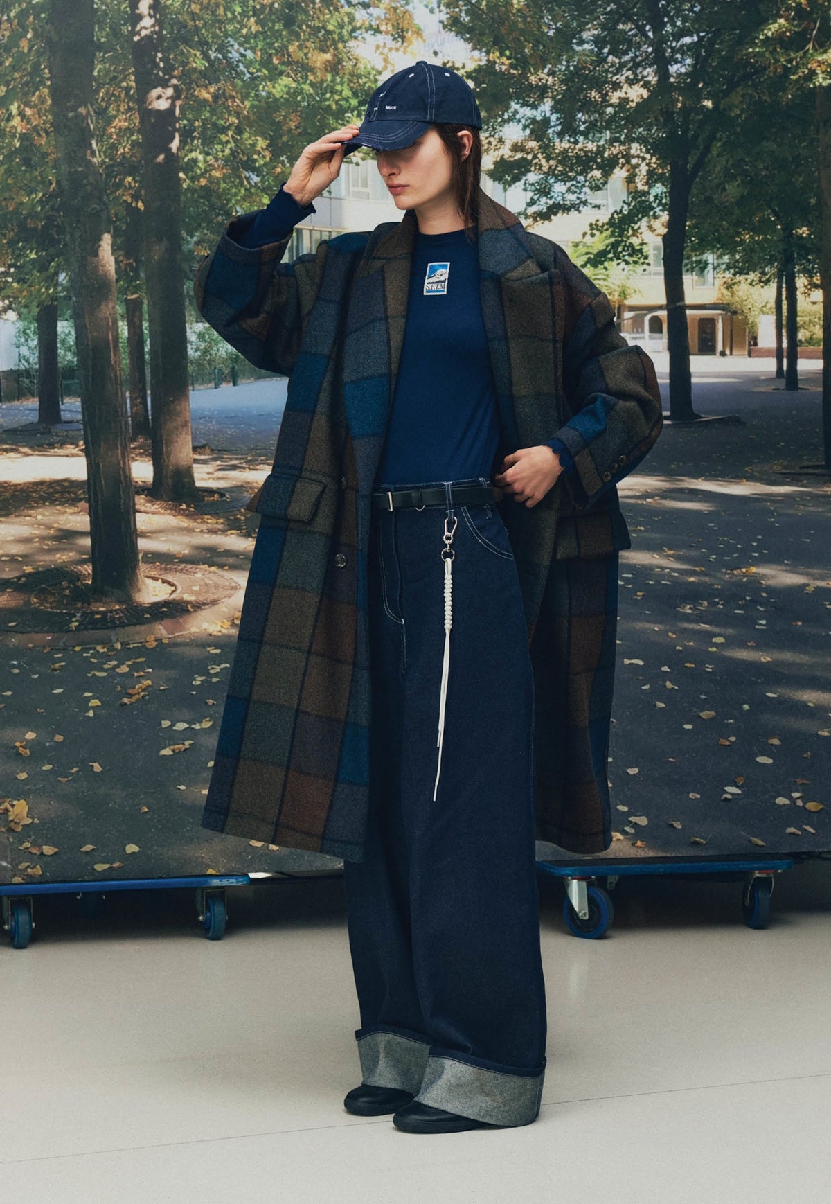 Song for the Mute Playground lookbook: model wearing the Bear Check double-breasted overcoat