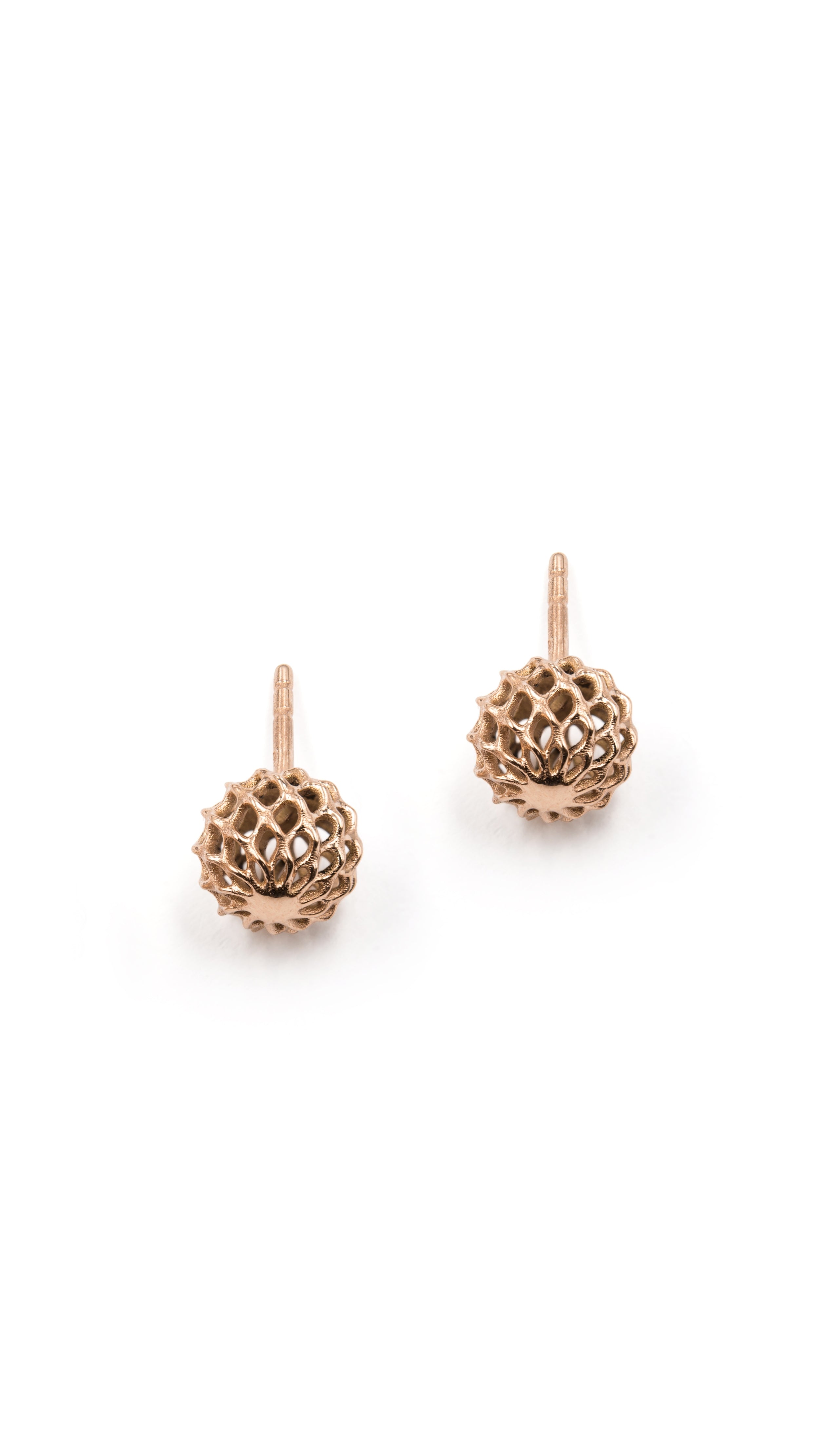 Elegant Iva Stud Earrings in 18K rose gold featuring a unique lattice shell design, showcasing fine jewelry with architectural detail.