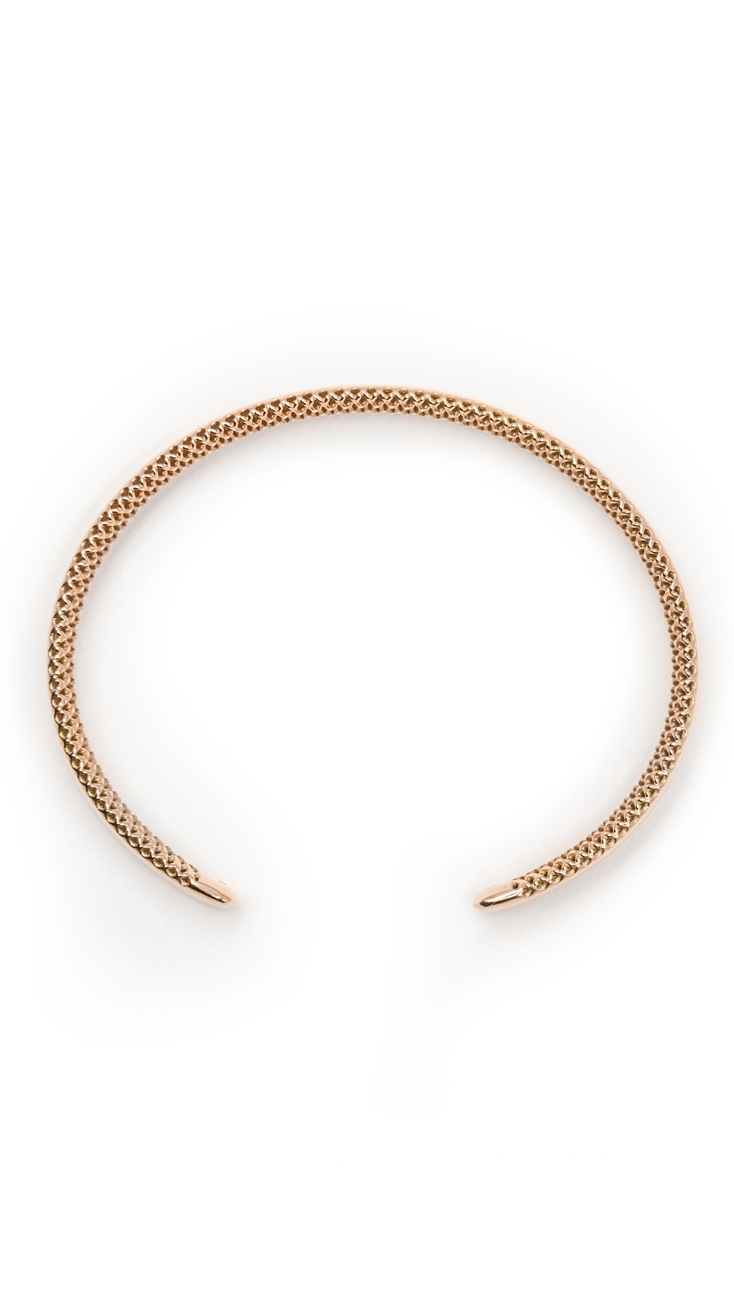 18K gold Ina Bangle bracelet with smooth inner surface and interwoven grid-like exterior shells, showcasing modern architectural design.