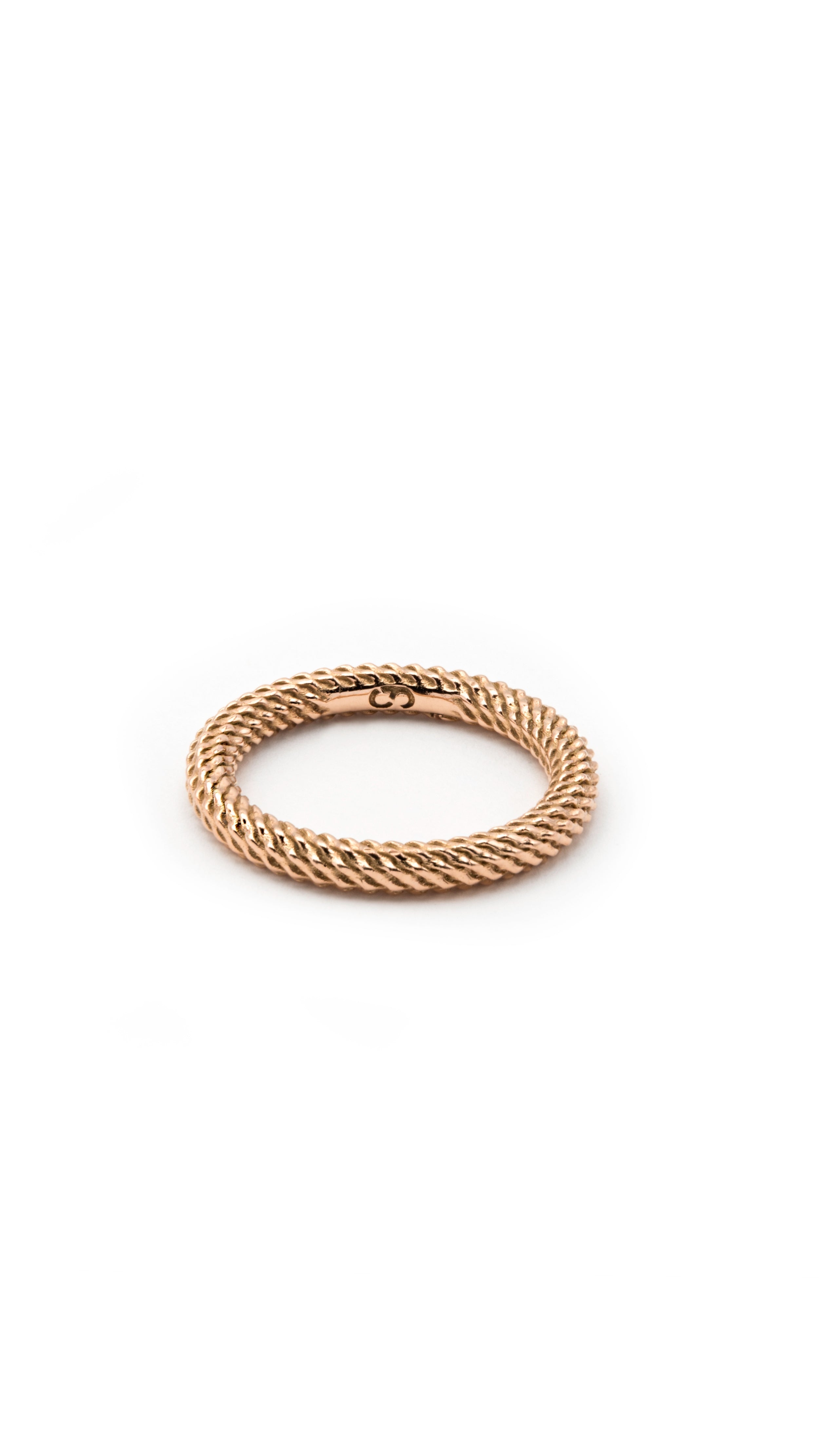 18K rose gold Nio Ring with interwoven strands forming a continuous thin eternity band, showcasing modern design and timeless elegance.