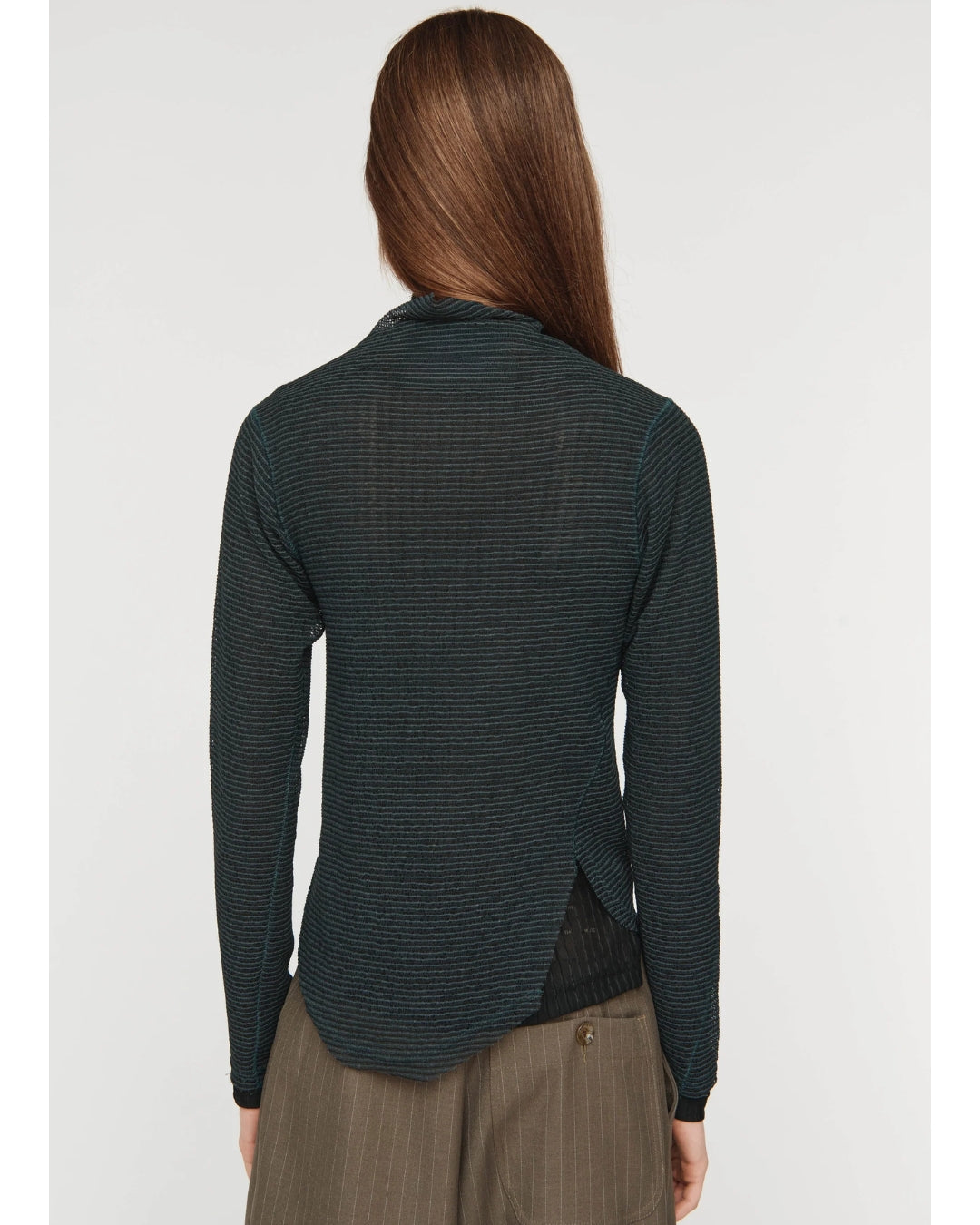 Song for the Mute Mock Neck Twisted L/S in green zig zag knit, back view showing twisted seam and asymmetric hem